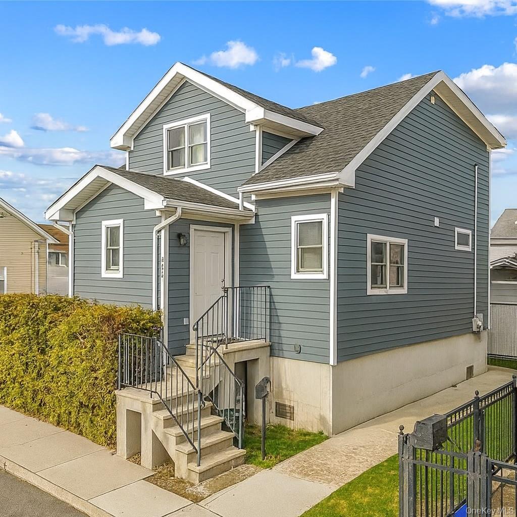 Beautifully renovated 3BR/2BA single-family duplex in Gerritsen Beach, fully updated in 2017. Features a raised first floor with open-concept living/dining, modern kitchen with breakfast bar, and sliders to a private yard and off-street parking and also features a full windowed bathroom and a laundry. Upstairs includes 3 bedrooms, including a spacious primary suite with ensuite bath. Updates include new roof, windows, siding, Navien on-demand heating, and updated mechanicals. Excellent storage throughout. Close to Parks, trails, shopping, and dining. Move-in ready!