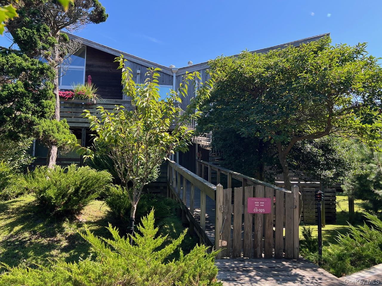 One of a kind, triple mint, designer 1 bedroom co-op. Garden facing, sunny, extra large terrace with retractable awning. Steps from both Harbor & beach.