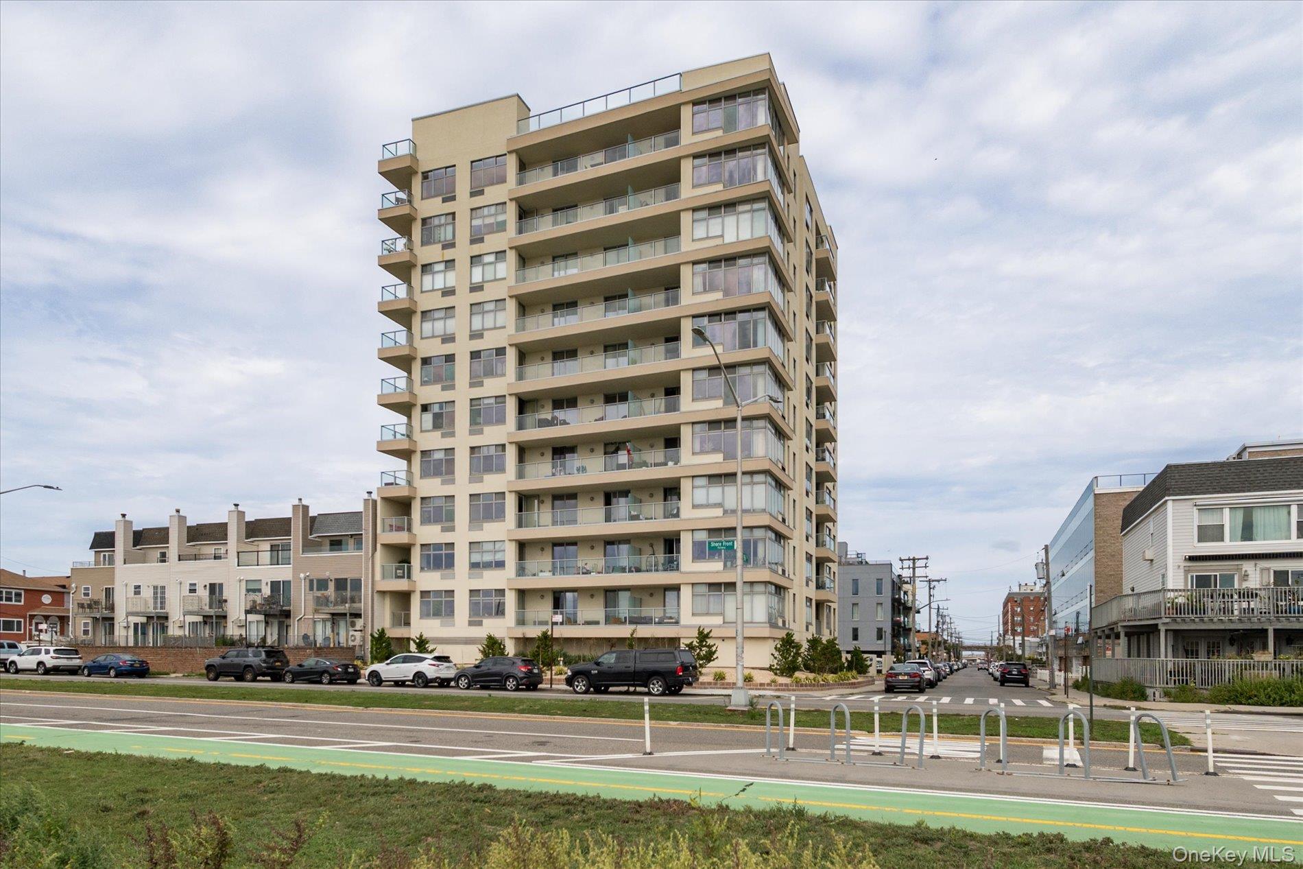 The Ultimate in Luxury Beach-Front Living Can Be Yours at Ocean One Condominiums! This ultra-clean and sleek 7th fl. 2 bd / 2 bath corner unit, has sweeping panoramic views of the ocean, the NYC skyline, the beautiful boardwalk and more! From the entry-foyer you are greeted with bright, pickled-oak hardwood floors, custom oak doors and built-in cabinetry. The kitchen boasts a shining white porcelain tile floor, light granite countertops and stainless steel appliances. Move freely throughout the gracious, open-concept LR / DR combo to your covered private balcony with breathtaking views of the ocean and wide-open recreation spaces. Breathe In the fresh air with your morning coffee as you watch for breaching whales and frolicking dolphins! Realize your dream-life at Ocean One with astonishing views from sunrise to sunset, whether you entertain in your unit or party with friends as the stars come alive from the rooftop terrace! Amenities Galore include a designated parking space, bike storage room, full-time on-site Super, and a quick and easy train commute to NYC! Enjoy the iconic Rockaway Beach Boardwalk, the sun, sand and surf, all while being close to shops, restaurants, cafes, and boutiques! This is coastal living at its finest!