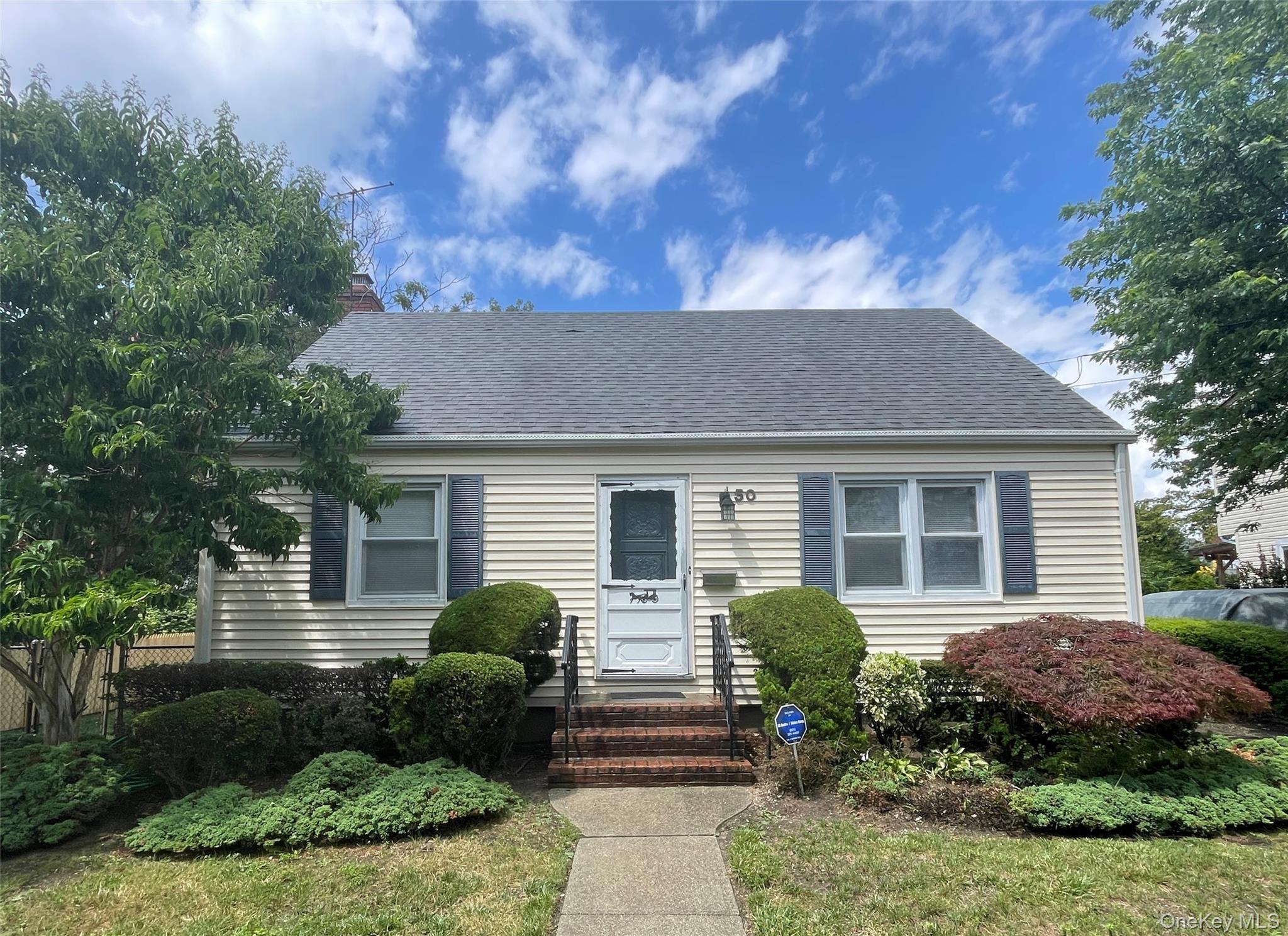 Welcome home to this 4 bed, 1 bath whole house rental. Trade high rents and small spaces for privacy and comfort. Includes driveway parking, a fenced in yard, patio with awning, lawn care, in-ground sprinklers, washer/dryer, hardwood floors and a partially finished basement. Close to public transportation and Southern State parkway making for an easy commute. This one will not last long.  1 month rent, 1 month security, 1 month broker fee due at lease signing. No pets and no smoking. Owner pays for lawn maintenance, sewer, trash, and water.  Landlord requires income verification, credit verification, background check, and landlord references.