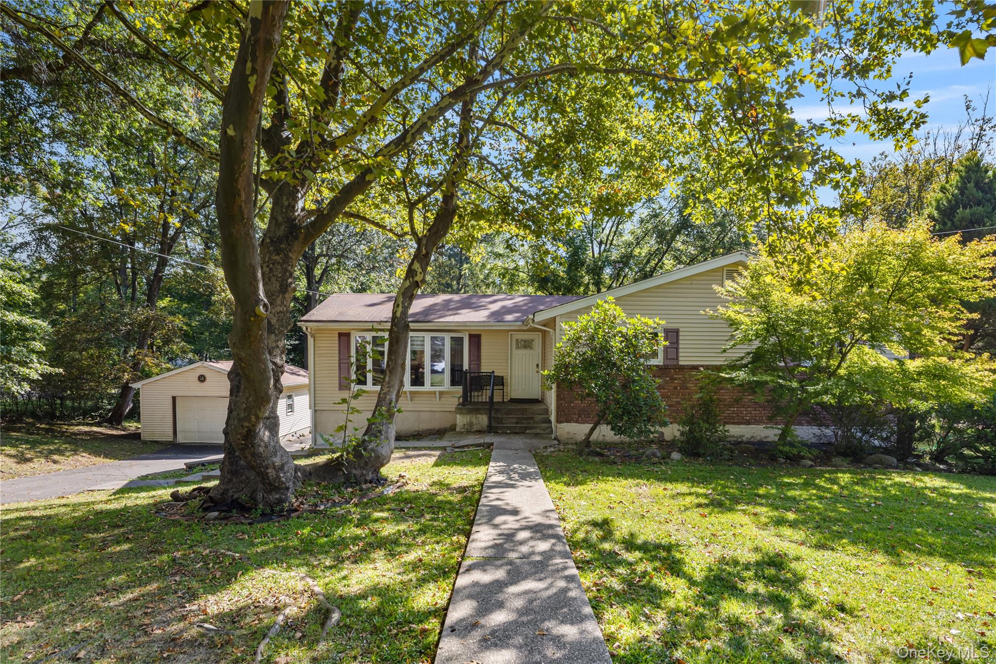 Welcome to this beautifully updated ranch home, perfectly situated on a large, flat lot in one of the most sought-after neighborhoods. This sunlit, move-in-ready house offers the perfect blend of comfort, style, and convenience. The heart of the home is the newly renovated kitchen, featuring modern finishes, generous cabinetry, and sleek countertops. The open-concept design flows seamlessly into the cozy living spaces, creating a warm, inviting atmosphere thatâ€™s flooded with natural light. Step outside to a generously sized deck, complete with a retractable awning that offers the perfect balance of shade and comfort. Overlooking the expansive backyard, this outdoor space is ideal for everything from leisurely afternoons to vibrant summer gatherings. The full walkout basement features a private bedroom with its own bathroom, offering ideal space for guests. A large laundry room adds convenience and extra storage. The basement offers endless possibilities for customization, whether as a family room, home office, or additional living space. Located in a highly desirable neighborhood, this home is truly move-in ready and offers an exceptional living experience. Donâ€™t miss your opportunity to make this stunning ranch home your own!