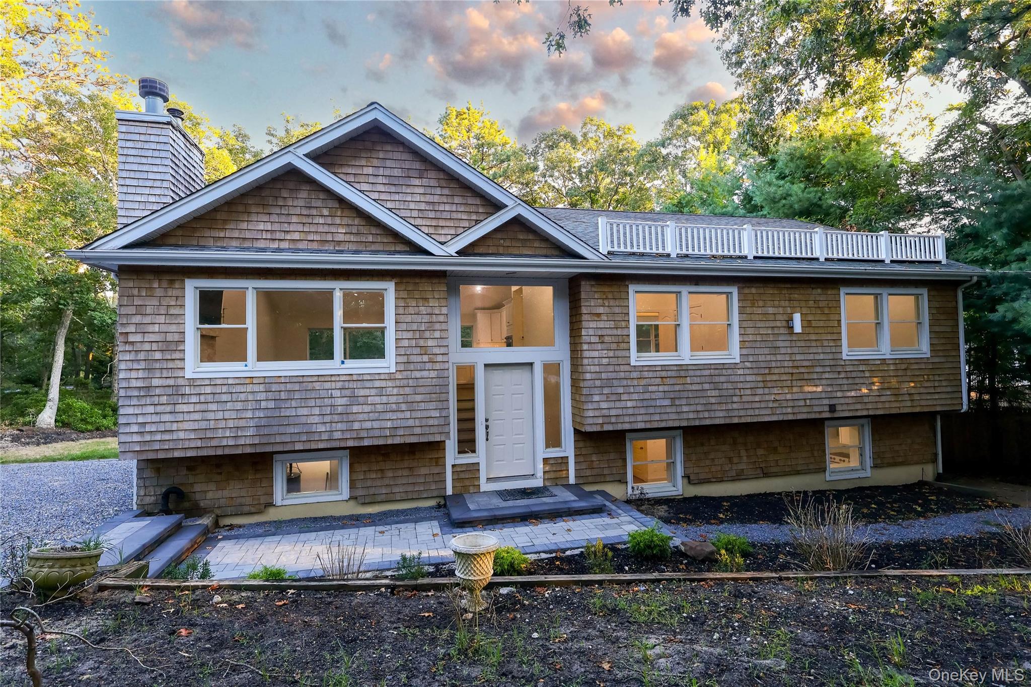 Welcome to this beautifully maintained Colonial in the Red Creek area of Hampton Bays. Featuring 5 spacious bedrooms and 4 full baths, this home offers an inviting open floor plan with sun-filled living spaces, hardwood floors, and a modern kitchen with stainless steel appliances. The large primary suite includes a walk-in closet and updated bath. Set on a private lot close to Peconic Bay beaches and Red Creek Pond, the property provides a serene retreat with plenty of room for outdoor living.
