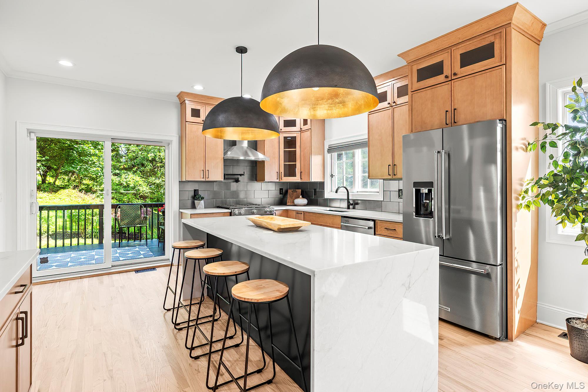 This stunning Colonial home sits proudly on a 1 acre corner lot blending timeless architecture with modern luxury. An inviting covered front porch welcomes you into interiors with rich hardwood floors and elegant finishes throughout. The living room boasts a marble wood burning fireplace with a decorative mantle while the chefâ€™s kitchen shines with an island, breakfast bar, stainless steel appliances, butlerâ€™s pantry, and sliders to a deck overlooking the expansive fenced yard and beyond. The dining room makes a statement with its modern chandelier, refined finishes, and generous proportions perfect for both intimate dinners and grand entertaining. A chic powder room completes the main level. Upstairs, the primary suite is a true sanctuary complete with a reading/den nook, walk in closet, and a spa inspired Italian marble bath. Designed with a resort like sensibility, it features a freestanding soaking tub, oversized walk in shower, and a double vanity framed by elegant finishes creating an oasis of relaxation and indulgence. An additional bedroom with electric fireplace and large walk in closet plus a spacious third bedroom and hall bath with double vanity add extra comfort. Laundry is conveniently located on this level. The finished basement offers a rec room and two versatile bonus rooms. An exquisite home that combines elegance, comfort, and timeless sophistication. Close to Sprain and Taconic Pkwys, Rt 202, many parks, shops, and restaurants. Don&rsquo;t miss out on the opportunity to own this stately home. Taxes do not include the star reduction.
