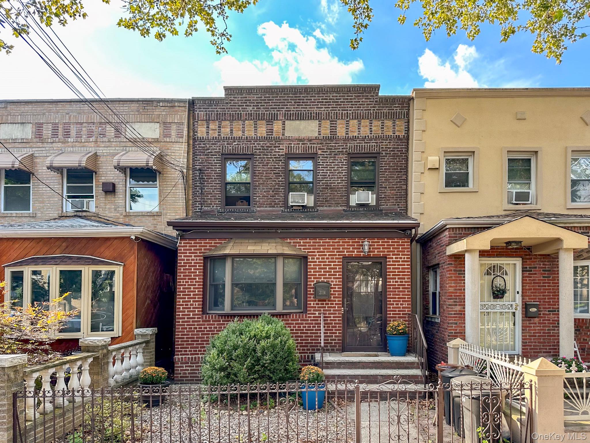 This charming, legal two-family brick home, currently configured as a single-family residence, boasts 3 bedrooms and 2.5 baths, and is ideally located on a desirable block in Astoria&rsquo;s Ditmars neighborhood.The main floor comprises a kitchen, formal dining room, living room, and a half bathroom, along with a versatile front room ideal for a home office or an extra bedroom. The second floor features a practical and comfortable layout with three bedrooms and a fully renovated bathroom. Each level, including the finished basement, includes a renovated bathroom.The kitchen, which is open to the dining room, includes a large island and a sliding glass door leading to a private and peaceful, fenced backyard. This outdoor space features a new deck and a large concrete patio, along with parking for one car behind the yard, with potential to expand by reconfiguring the fence.There are 2 electric meters in addition to two separate gas meters. With a reconfiguration of the layout, this home can be used as a legal 2 family. Lots of options here should you wish to make a change. The home showcases lovely features such as high ceilings, picture frame mouldings, and even a beautiful foyer. The gated front yard is adorable and welcoming too. Donâ€™t miss out on this terrific opportunity.
