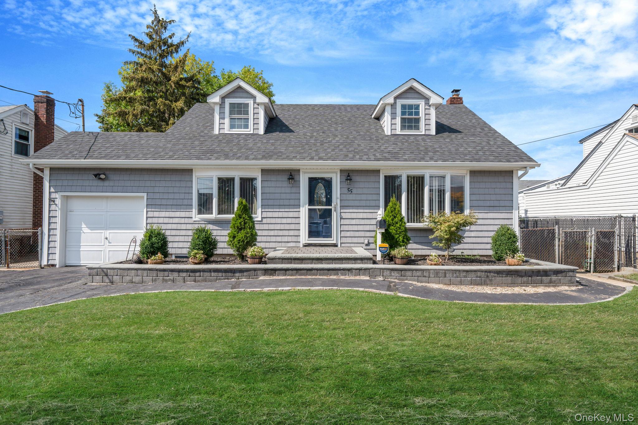 Welcome to 55 Barbara Drive!This charming three-bedroom, two-bath Cape is perfectly situated mid-block in a quiet neighborhood. The exterior features classic vinyl shakes for a timeless look, a paver stoop with matching garden borders, and an asphalt driveway and walkway for easy maintenance.Inside, youâ€™ll find an updated kitchen with stainless steel appliances, hardwood floors, and cozy carpeted bedrooms. One of the baths has been beautifully updated, adding a modern touch. The home also boasts a full finished basement with an outside entrance, offering additional living space and flexibility.Move-in ready with curb appeal and updates throughout â€” donâ€™t miss this wonderful opportunity to make it yours!