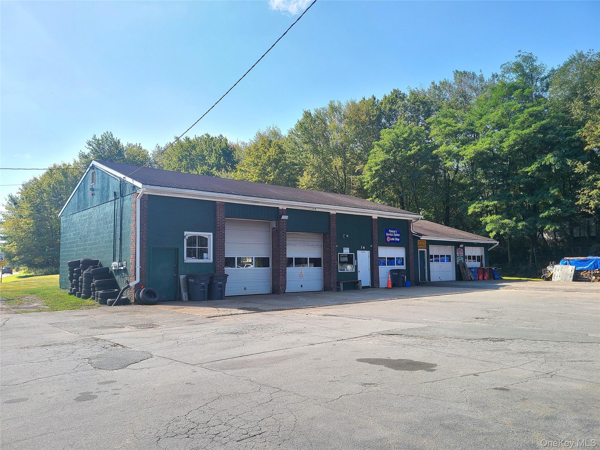 This Monticello location provides substantial versatility for mixed-use development and is situated in a highly desirable area. With its long history as an auto mechanic shop, the lot offers large parking and storage areas plus an investment/ rental unit. The main attraction is the garage, which is just under 3500 square feet, offers five overhead doors of various heights, an office, restroom, has heating, and is currently configured for automotive business. It would also be suitable for other uses such as for contractors, towing business, woodworking, retail establishment, or ideal storage for equipment, etc. Second building, which is approximately 2000 square feet, was formerly a duplex and still has two electric meters. It is rented by a single tenant who has combined the space but could be converted back, if desired. A perfect set up for live/ work, management quarters, or extended business use. Property is zoned HC2 which is favorable for many uses and is serviced by municipal sewer and a drilled well. Municipal water is approximately 500 feet away. Monticello is a very central and convenient location, and this property offers extremely large road frontage of over 700 feet on Cold Spring Road/ County Road 102 making it easy to access for vehicles, deliveries, large trucks and equipment. Zoning and the survey/site plan map are included in the documents.