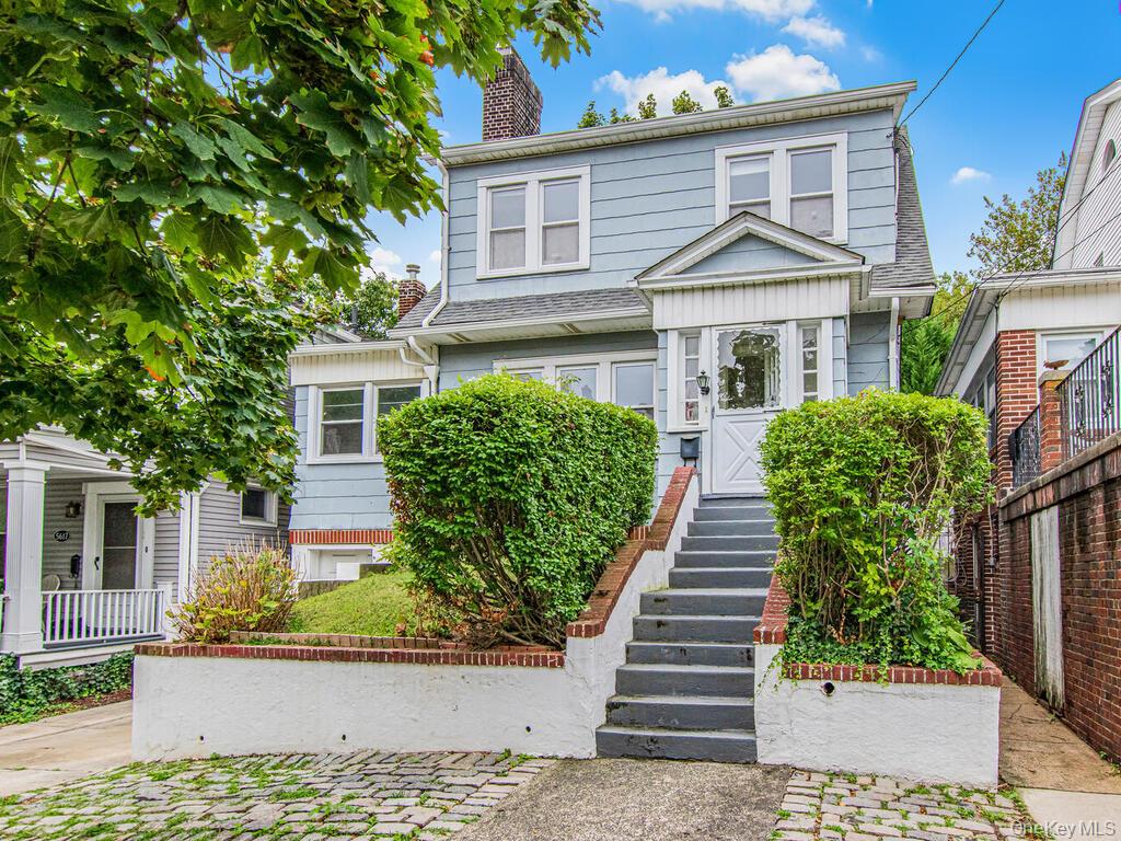 Charming 4 bedroom Dutch Colonial home with great outdoor space in North Riverdale on a quiet tree-lined street First floor includes light filled open living room with wood burning fireplace, adjacent formal dining room, eat-in kitchen and cozy wood paneled office/playroom. Four bedrooms and full bathroom with large storage attic complete the second level. Semi-finished basement with half bath and access to stone patio. Outdoor deck from kitchen leads to lovely landscaped level grass yard and garden. Indoor garage and driveway accommodates parking for two cars. Original hardwood floors throughout. Conveniently located to shops, parks, houses of worship, and transportation. Won&rsquo;t last!