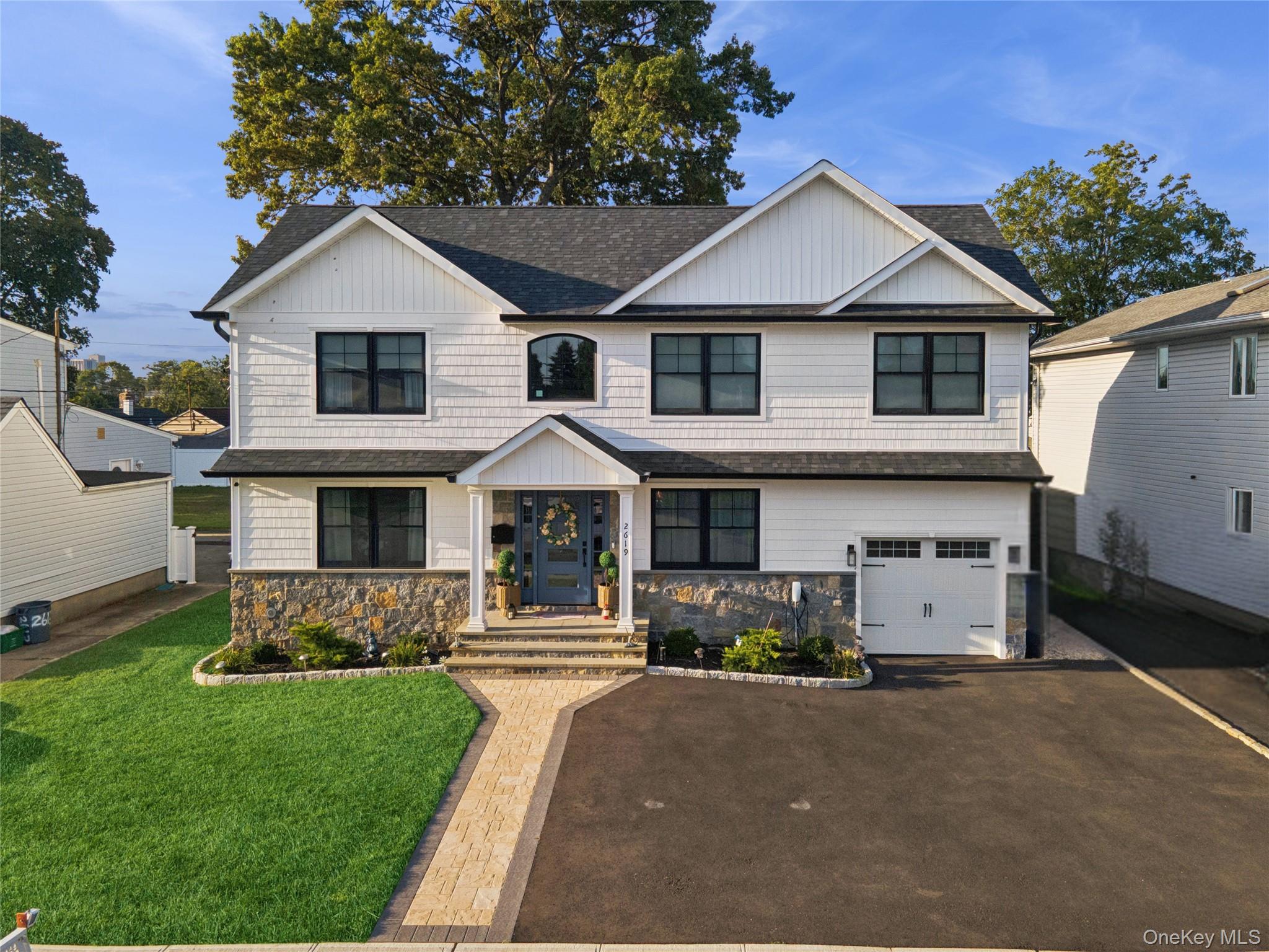 Welcome to this stunning 5-bedroom, 3-bath residence that perfectly blends elegance, comfort, and modern convenience. This home was completely rebuilt in 2024.Step inside through the grand 20-foot foyer, where natural light pours in from skylights and reflects off the beautiful white birch hardwood floors that flow seamlessly throughout. The homeâ€™s open floor plan is enhanced with detailed wainscoting, custom window treatments, energy efficient windows, and designer drapes, At the heart of the home, the gourmet kitchen impresses with a huge center island, smart appliances, built-in microwave, and much more.The luxurious primary suite is a true retreat, featuring a massive walk-in closet and spa-like ensuite bath with double vanity, a double rain shower enclosed in custom glass doors, and a separate luxurious soaking tub. The fully finished basement offers an outside entrance, a stylish wine and beverage bar, and plenty of versatile space for entertaining, recreation, or extended living. Additional highlights include the Ring system with security cameras throughout the exterior of property, in ground sprinkler system,  3-car driveway, and a fully fenced in spacious backyard. This home is filled with thoughtful upgrades and countless details. Schedule your private tour today and experience all this incredible property has to offer!
