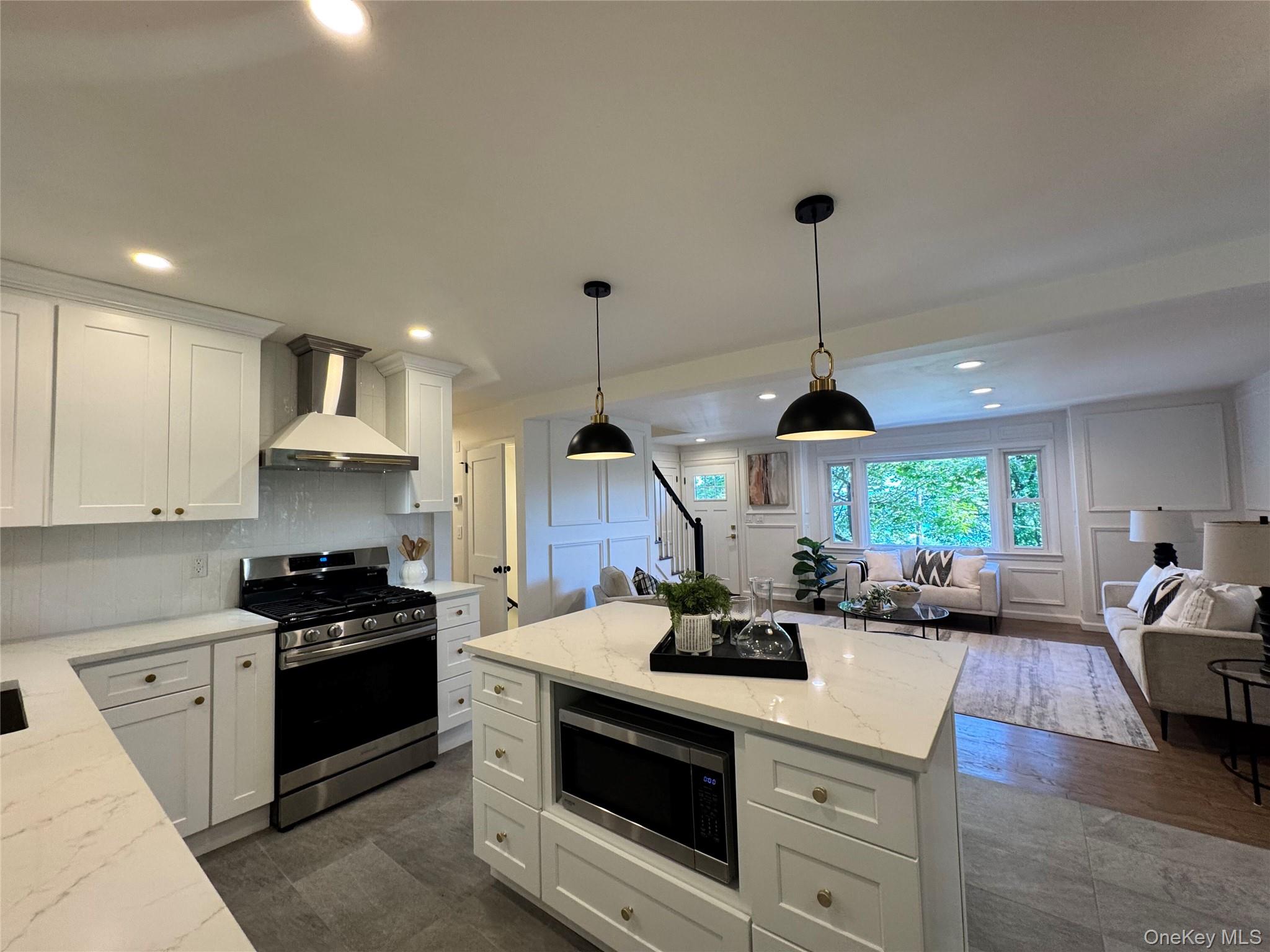 Welcome to this exquisitely renovated four-bedroom, two-bath unit in a Nyack duplex where timeless charm meets modern sophistication. Enjoy seasonal Hudson River views from this fully reimagined home, offering two levels of thoughtfully designed living space. The main level features a chefâ€™s kitchen with quartz countertops, an oversized island, custom cabinetry, and premium stainless-steel appliances. The living room, with its gleaming hardwood floors, elegant wainscoting, and large panoramic window, flows into an additional warm family room that opens to a patio and private backyard, ideal for entertaining or quiet evenings. Two bedrooms and a brand new spa-like full bath complete this main level. Upstairs, enjoy the primary suite with a balcony porch overlooking the river and direct backyard access, and an additional bedroom and sleek modern bath. Additional amenities include: a private laundry room in the lower level, central & split units cooling and heating systems, and a one car garage plus driveway parking. Additional Street Parking (across the street & along the stone wall by 20 Terrace Dr). Conveniently located near major highways and the Mario Cuomo (Tappan Zee) Bridge, with easy access to the vibrant shops, dining, and riverfront parks of Nyack and Piermont. This unique and exceptional home blends luxury, comfort, and convenience. Tenant is responsible for all utilities, snow removal, and landscaping. Perhaps the best luxury rental option in Nyack!