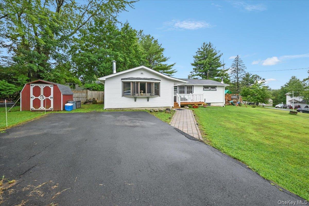 Nestled in scenic Mountaindale, Sullivan County near Monticello, this charming single-family ranch offers comfort and convenience on a desirable corner lot. The home features three bedrooms and 1.5 baths, including a bright living room with vaulted ceilings ideal for relaxing or entertaining. A modern kitchen with ample cabinetry connects seamlessly to a cozy dining area. Each bedroom offers generous closet space and plenty of natural light, complemented by a full bathroom and an additional half bath. A standout highlight is the heated four-season sunroom, perfect for year-round enjoyment. With a new roof recently installed, this property combines peace of mind with inviting style. Conveniently located near local shops, restaurants, and recreational opportunities, it also provides easy access to nature trails, parks, and the stunning scenery of the Catskillsâ€”blending tranquility with modern amenities.