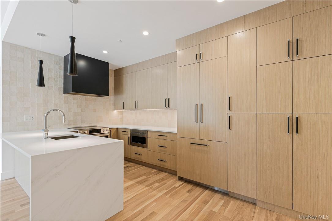 ONE67 - High end luxury rental units by LORONO Homes. As you enter, the sophisticated selections set the tone- from the ribbed wood accent adorning each entry, to the textured wall covering, and intentional lighting... flawless perfection comes to mind. High elevation takes advantage of southwest facing exposure enjoying the sunsets and natural light. Distinctive features include high ceilings, open floor plan, each dwelling boasts a corner unit with a glass balcony, two parking spots per unit included in rental price, electric charging stations on property, rooftop oasis with seating/ grilling area, and a discreet landscaped dog run on the ground level. Custom fitted window shades included. Located on Purchase Street in downtown Rye just steps from train, shops and restaurants. Luxury living redefined! Occupancy available 10/21/25.