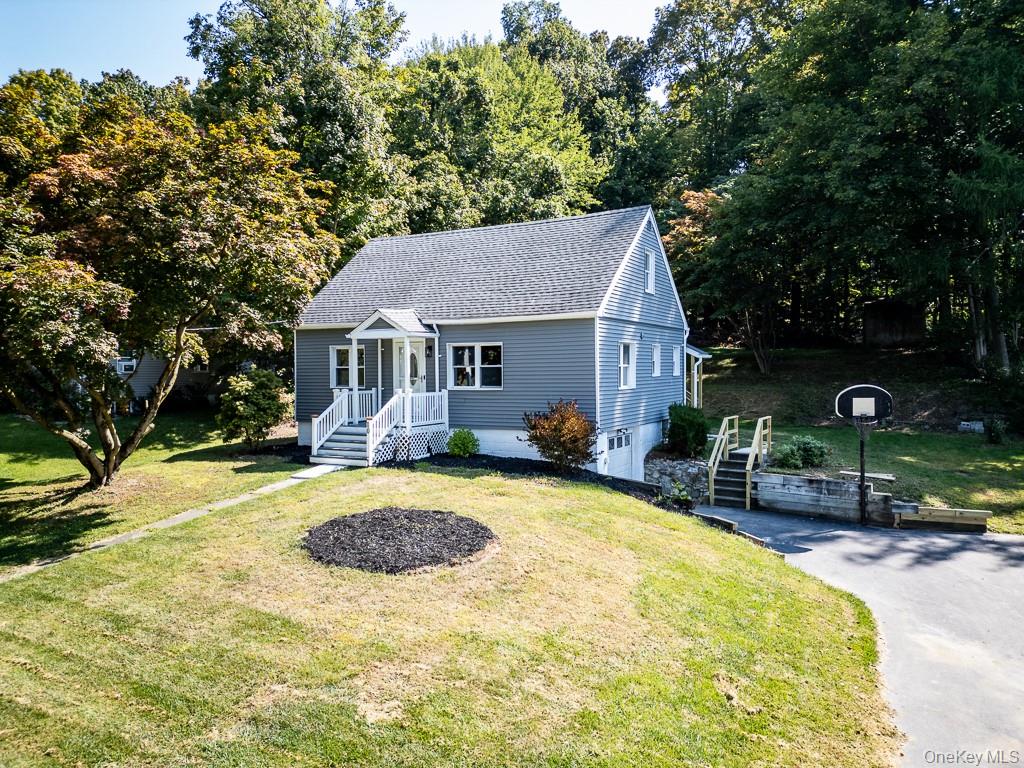 Just Move In! To this Lovely Cape Cod Home. It features a Bright, inviting Living Room with hardwood floors and glass covered fireplace. A Brand-New Eating Kitchen features quartz counter tops, back splash , stainless steel appliances and access to a rear sunroom with a new adjacent Deck overlooking a private back yard ideal for barbecuing, relaxing or entertaining guests. The Main Level also includes a Bedroom and full bathroom. The Second floor offers two more good-sized bedrooms with ample closets. Additional updates include New Floors, New Water heater, New A/C Condenser and Freshly Painted Interior. The basement provides additional storage and endless possibilities. One Attached Garage. Plenty of Parking Space. Arlington Schools. Perfect Commuter Location! Close to Vassar College, Marist University, the Taconic State Parkway, Metro North Railroad and Amtrak station, Hudson Valley Rail Trail, The Culinary Institute of America and the Dutchess community College . Minutes to the villages of Eastdale, Pleasant Valley, shops, restaurants and more amenities this beautiful community has to offer.