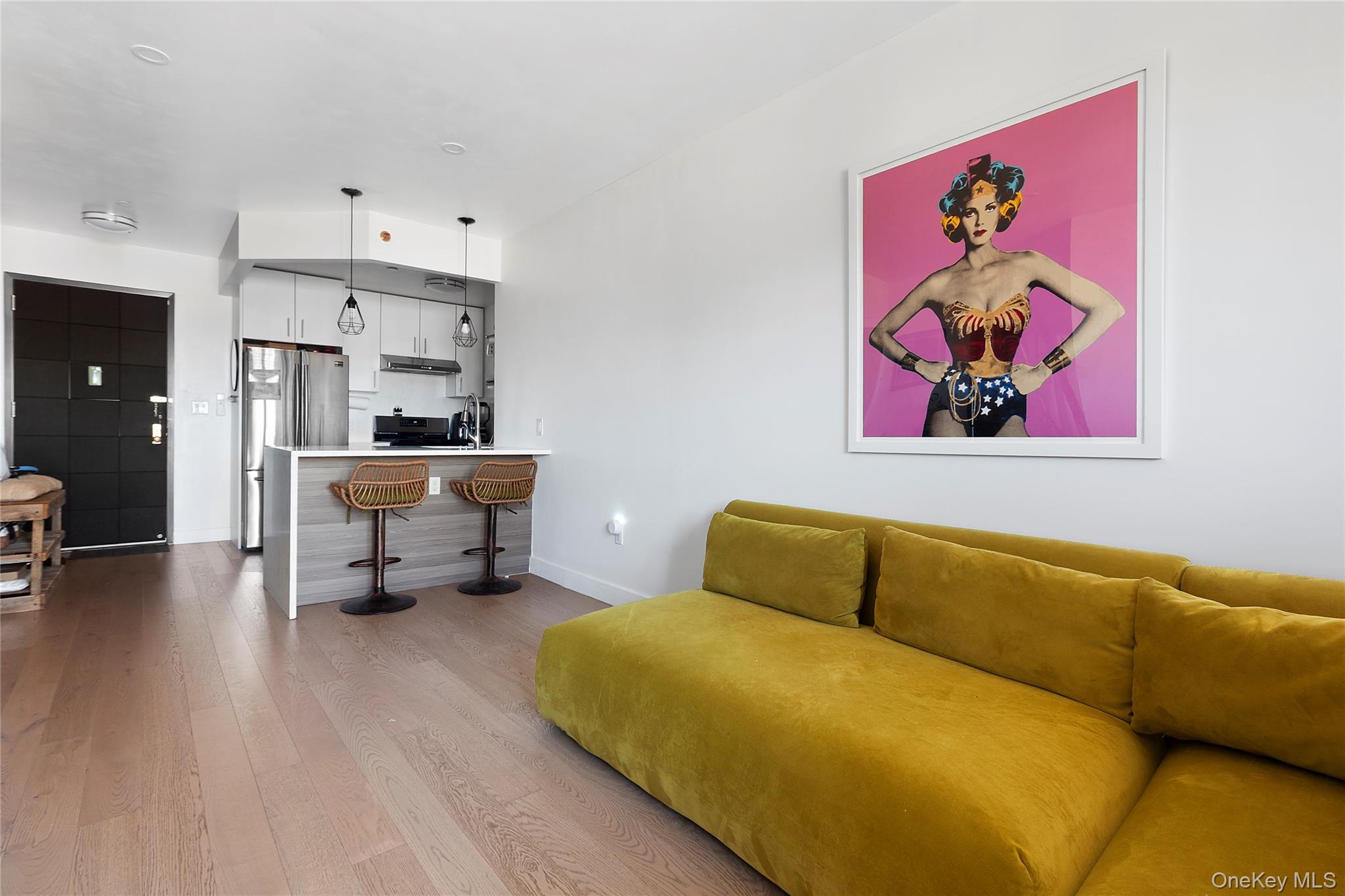 Welcome to Rego Parc Condo. This bright and modern 2-bedroom, 2-bathroom home offers an airy open layout, high ceilings, and floor-to-ceiling windows that flood the space with natural light. The contemporary kitchen features stainless steel appliances, sleek cabinetry, and ample counter space, flowing seamlessly into the living area with direct access to your private balcony, perfect for morning coffee or an evening unwind.The spacious primary suite includes an oversized closet and spa-like en-suite bathroom, while the second bedroom is ideal for guests, a home office, nursery, or anything your imagination can conjure. Thoughtful details include ductless HVAC units in every room for customizable climate control and double-paned windows for peace and quiet.Rego Parc Condominium offers a full suite of amenities including a fitness center, common laundry, bicycle storage, and garage parking. Conveniently located near Juniper Valley Park, shopping, dining, and public transportation, this home blends modern comfort with neighborhood charm, a perfect choice for those seeking value, space, and style in Queens.