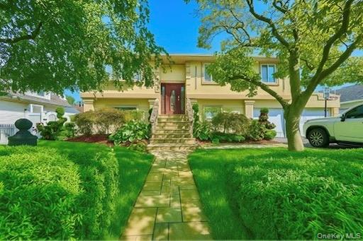 Grab this rare opportunity in the heart of Inwood! Located on a quiet and tree lined, dead end street , this home features a rare extra large 80x100 lot with a beautiful and private, manicured backyard. This home has been fully updated with new kitchen and baths, windows, central air, heating system, high end appliances, skylights , new flooring with radiant heat on the lower level, large home theatre, private 2 car driveway, and much more! Low taxes under $10, 000!This home is a must see! Call Today!