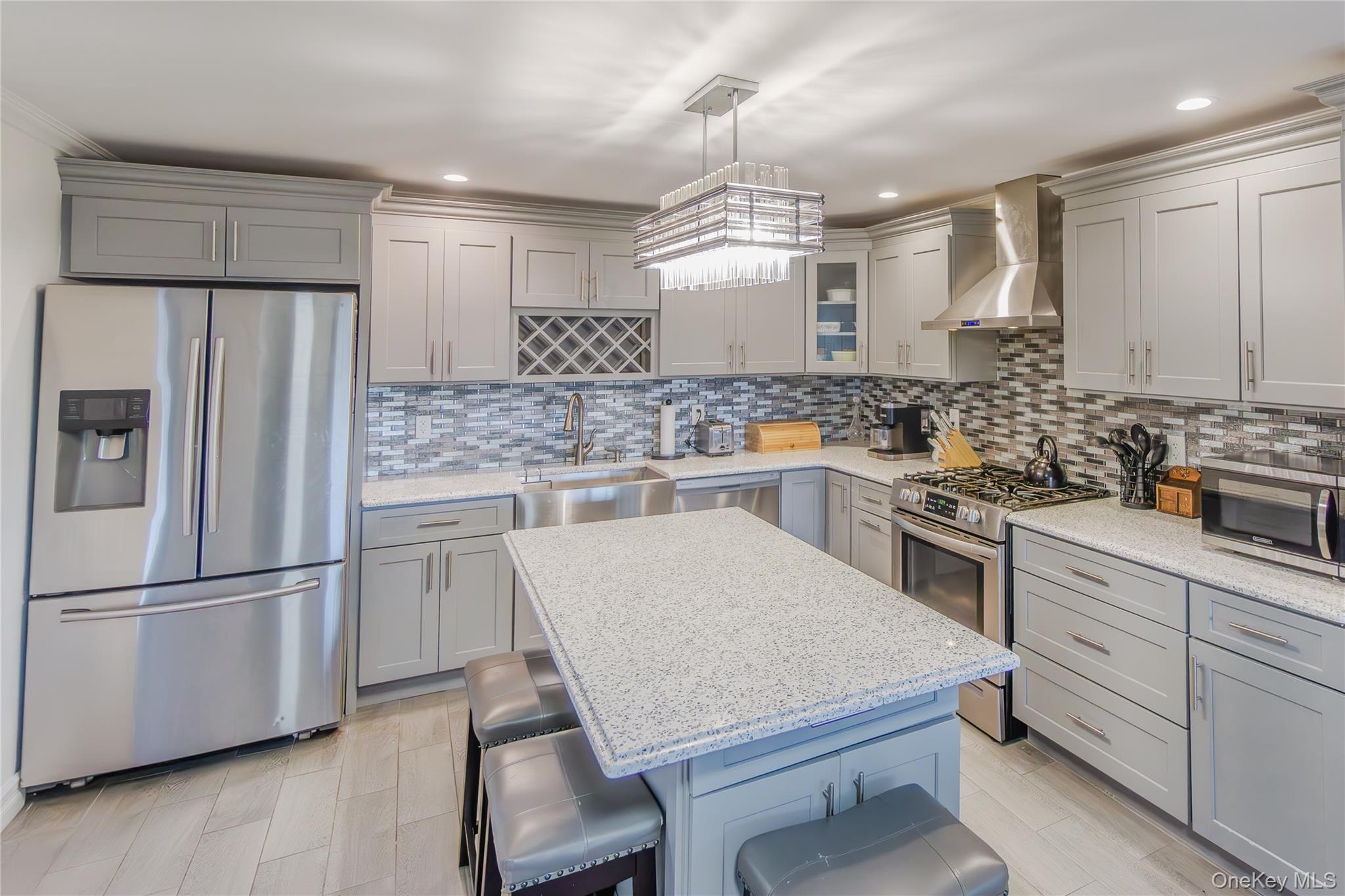 Welcome Home to this recently renovated property, featuring 4 Bedrooms, a high-end kitchen with Granite Countertops, and an Island with Plenty of room for entertaining, while enjoying the warmth of your wood-burning fireplace. Enjoy the open floor plan with plenty of natural light and incredible sunset views every night. The large covered deck is perfect for extending your living space outdoors. The oversized yard is ideal for a variety of uses. The high-ceiling, 2-car garage has so much potential beyond just storing cars... The house is a must see, the only it is missing is YOU!!!