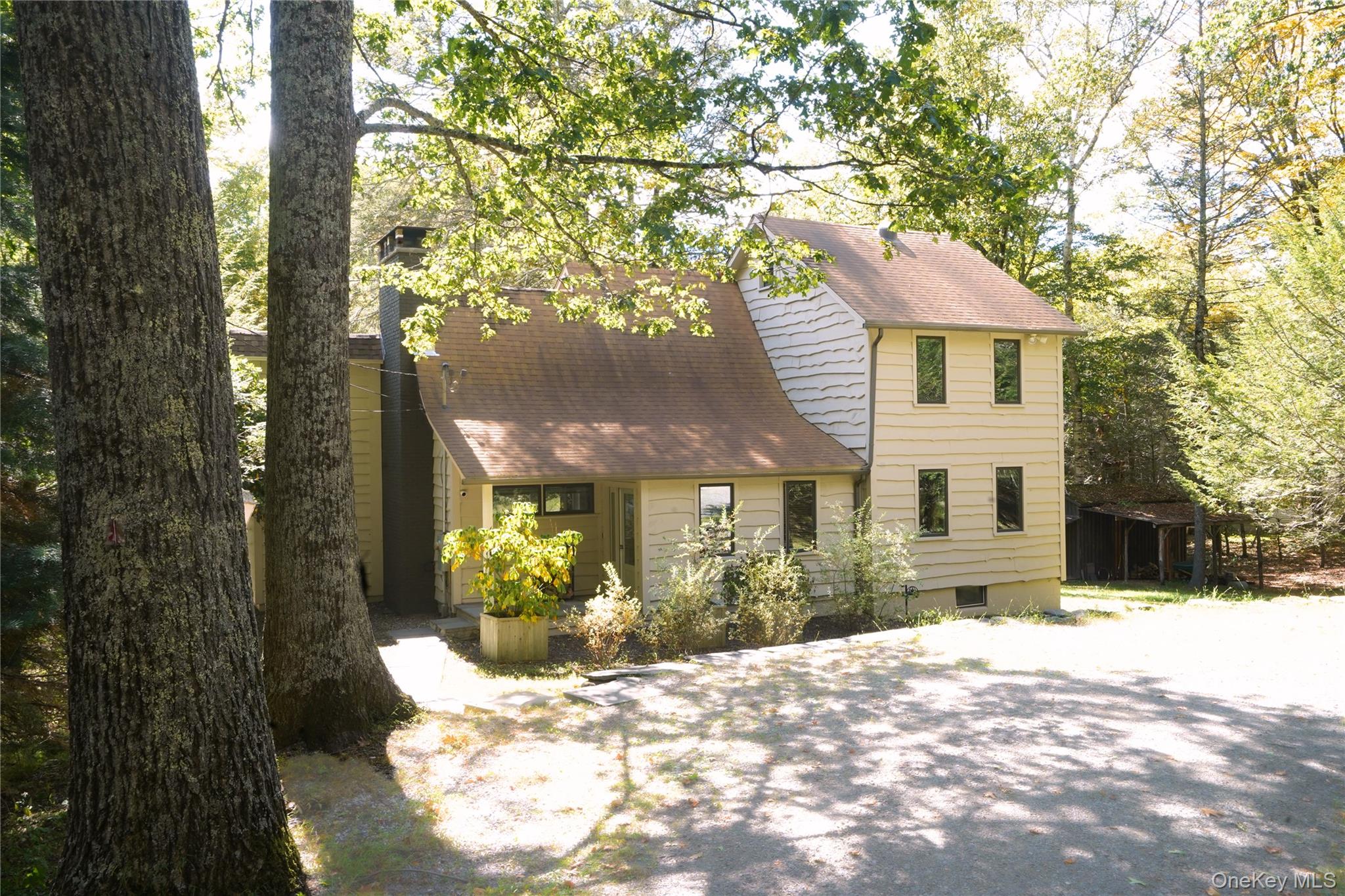 A chic country compound just minutes from Woodstock and Phoenicia. Situated in the picturesque hamlet of Willow, youâ€™ll find this two-acre property that features a charming three-bedroom main house, separate guest quarters/office, an extraordinary fully reimagined two-story barn, and a spring-fed pond â€“ all framed by the tranquil beauty of the Beaverkill Stream. This breathtaking setting offers 510 feet of creek frontage, with the waterway naturally defining the rear boundary. Mature sycamores, hemlocks, birch, and oaks provide shade and shelter for wildlifeâ€“from blue jays, robins, and hummingbirds to the occasional springtime ducks enjoying the pond. Sugar maples invite tapping for syrup, while ramps, chanterelles, wild strawberries, and chicken of the woods have been found and enjoyed seasonally. Enjoy the ever-changing palette of wildflowers and sounds of nature that sweep the property. A circular driveway adorned with two Japanese maples lead to a stone walkway directing to the front entry and a convenient, heated mudroom. The main house was thoughtfully oriented to capture winter sunlight while remaining cool and shaded in summer. Inside, vaulted ceilings and natural wood tones create an inviting ambiance. The living room is anchored by the stone fireplace with sleek Jotul insert, while bold radiators provide warm heat without the dryness, keeping the space comfortable in the cooler months. Sliders open seamlessly to a deck overlooking the property. The spacious eat-in kitchen boasts soapstone counters, a handmade Moroccan tile backsplash, and a new Liebherr refrigerator which is adjacent to a generous pantry. A full bathroom with tub is tucked in the corner and provides exterior access, conveniently serving guests staying in the cottage or barn.The first-floor primary bedroom features an ensuite bathroom with a full tub. The hallway leads to an office or flex space. Upstairs, a spacious lofted sitting area offers sweeping views of the pond, stream, and forest canopy, evoking the feeling of a tranquil treehouse. Two additional bedrooms share a half bath. The basement houses all mechanicals and provides easy access to the ground level via walk-out. Recent upgrades include a high-efficiency boiler, whole-house generator, radon remediation, and laundry. The separate, heated guest quarters, once a pony stall, has been transformed into a cozy hideawayâ€“also ideal for WFH, meditation, or writing. The two-story barn is a true masterpiece. Fully gutted in 2024, no detail or expense was overlooked in its renovation. White oak floors, staircase, and custom built-ins lend warmth and sophistication. The expansive bluestone patio and woodland views gleam through the oversized Marvin slidersâ€“blurring the boundary between outside and in. The first level is currently enjoyed as a space for wellness, yoga, and sound gatherings, while the upper floor houses a professional-grade music studio, constructed with soundboard and plywood behind the drywall for superior acoustics. Hand-brushed limewash walls add organic texture throughout. Check out the special view from the oversized windows on the second level that perfectly frame the stream and the pond below. Youâ€™ll appreciate the custom built-in storage with seating on the landing. All new electric with three mini splits provides comfort year-round. The exterior renovation was equally comprehensive: new roof, resurfaced driveway, raised and regraded foundation, thermal dry insulated decking beneath the flooring, and discreet flood protection lining. The entire space is ideal for creative work, gatherings, or even a home business ventureâ€“complete with a dedicated driveway. Thereâ€™s even room for a future garage near the main house, if desired. Located less than two hours from the George Washington Bridge, and near the Hudson Valley and Catskillâ€™s best hiking, skiing, fishing, art, music, and restaurants. Don&rsquo;t miss this rare opportunity.