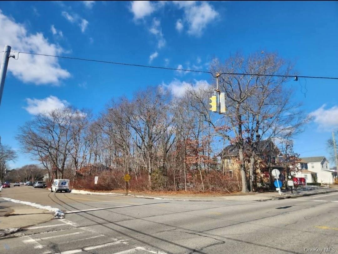 Highly Visible Prime Vacant Commercial Corner Lot with Building Permit for 3, 000 Sq Ft Office Building. Ready to Break Ground. Will Lease and Build to Suit or Sell Land. This property is zoned Medical/Office. This location is a gateway to the Village of Patchogue and all that it offers. There are no vacant lots left like this in town.