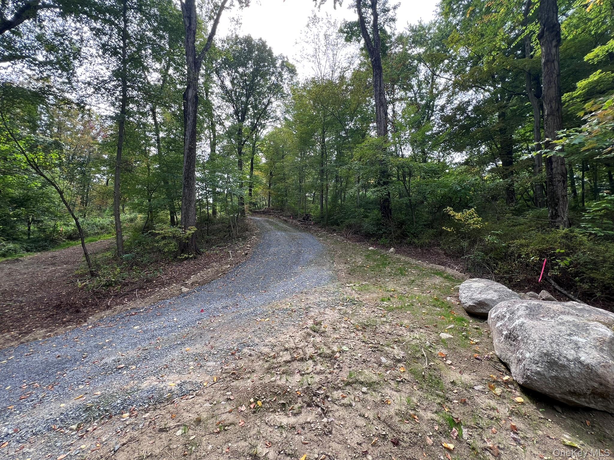 Gorgeous approved lot on desirable Old Albany Post Rd. in the heart of Garrison! Property borders New York State land and adjacent to Fahnestock Park, with access to Catfish Pond. Private and wooded, but minutes from historic Cold Spring Village. Newly updated board of health approval for a four bedroom home. Driveway and curtain drains installed. Bring your building plans!
