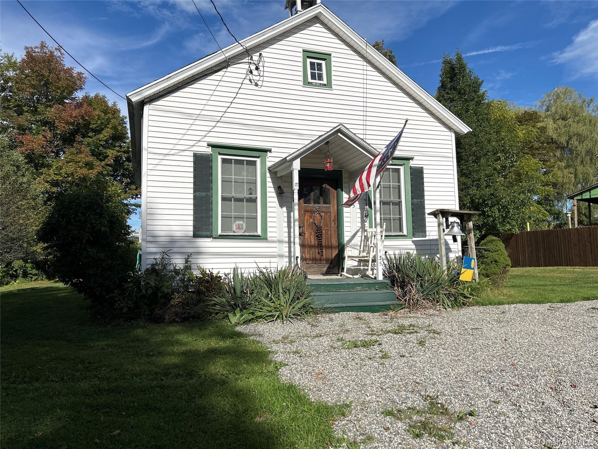 Discover the charm of this unique two-bedroom converted 1865 schoolhouse for rent near Millerton, NY. Available immediately, this home features beautiful wood floors, a classic beadboard ceiling, and an open-concept main living area with soaring high ceilings. The main level offers two comfortable bedrooms, while the loft space adds flexibility for an office, guest area, or creative retreat. A cozy propane woodstove enhances the atmosphere, complemented by central air and a propane heating system for year-round comfort. Set on .48 acres with stunning afternoon sunsets, this property offers both character and convenience, just minutes from the Village of Millerton and all its amenities.