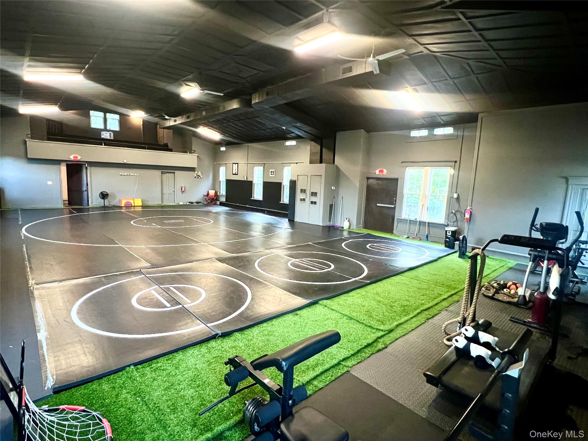 COMMERCIAL SPACE in MIDDLETOWN is now available for Sub-lease. A Martial Arts school is looking to share the open workout space with the ideal candidate looking for a excersise-training area, Yoga, Pilates, Cycling, etc. This Victorian Building is minutes from the high traffic of Downtown Middletown with short distance to the Paramount Theater. This 2nd floor open space offers over 3, 000 sq ft of open space with high cathedral ceilings, spacious private eat in kitchen with stove & refrigerator, 2 separate bathrooms which consist of 2 stalls in the women&rsquo;s bath and 1 stall in the men&rsquo;s bathroom. Currently being used as Funky Panda Wrestling Club. Within short distance to Touro Medical as well as OCC College, Fine dining, Shops & Heritage Trail. Private parking available as well as street parking. All utilities are included!!! Call for further information and to get a private Tour!