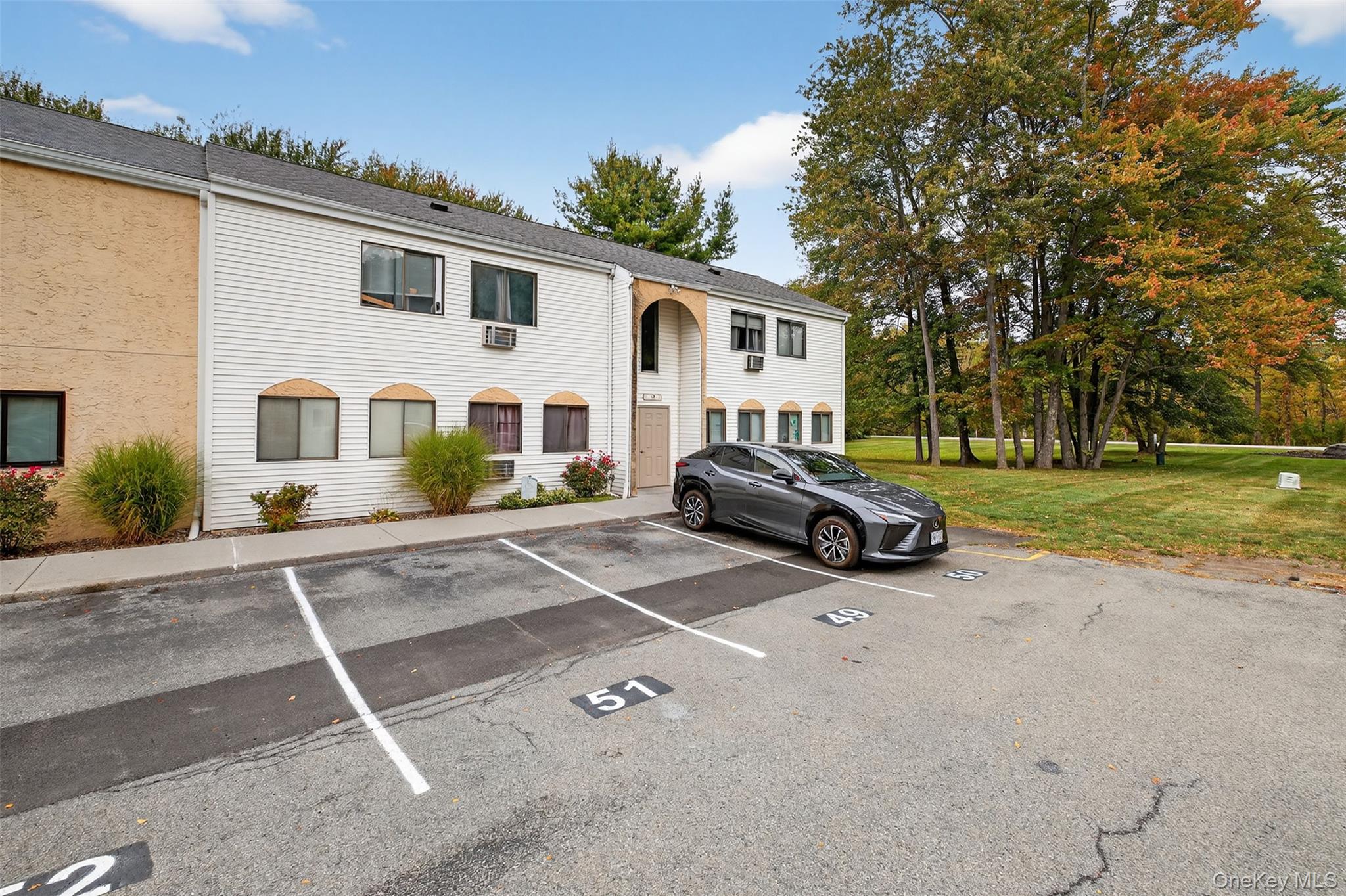 Welcome to this beautifully maintained 2 bedroom 1 bath condominium offering 1, 030sq ft of comfortable living space in a well established community in Wappingers Falls. Whether you are a first-time buyer, looking to down size or investor, this move in ready unit offers exceptional value and convenience. Enjoy a bright and open layout featuring a spacious living and dining area, an efficiently designed kitchen with ample cabinet space and two general sized bedrooms with closets. Off the dining you will find a deck surrounded by mature foliage that gives seclusion to either start your day from with a cup of coffee or unwind at the end of day. Plus, this unit comes with washer and dryer, providing the connivence of in-unit laundry.Located in a quiet, landscaped complex with fantastic amenities, residents can take advantage of a swimming pool and playground. Conveniently situated near Route 9, major shopping centers, restaurants and Metro North train station and within 15 minutes of I-84.
