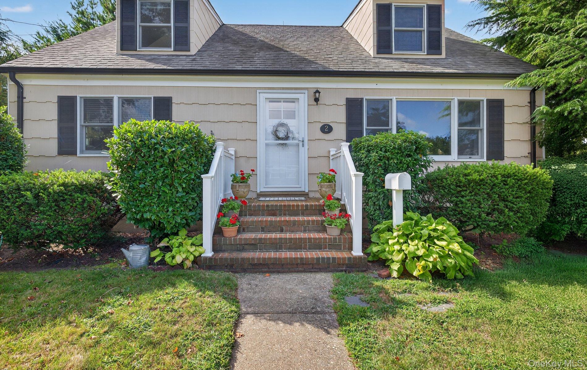 Welcome to this beautifully maintained expanded Cape set on a picturesque, fenced corner lot in South Amityville. Bordered by vibrant landscaping, this home offers both charm and comfort inside and out. Step into a sun-filled living room highlighted by a brand new gas fireplace with a striking stone surround. The open layout flows seamlessly into the dining room and kitchen, where you&rsquo;ll find abundant cabinetry, shelving for display, ample counter space and a brand new gas range, all accented by new luxury vinyl flooring. Two spacious bedrooms and a full bath on the main level provide versatility for family, guests or a home office. Upstairs, the inviting primary bedroom features a custom closet, storage eaves and plenty of natural light. A generous full bath with room for extra linens sits just outside, along with another bright bedroom and access to an adjoining attic with a big closet. The full basement offers endless storage, laundry, an additional refrigerator, and a sink. Recent updates include a new deck with a retractable awning, Hunter Douglas wooden blinds, in ground sprinklers and more. This private, beautifully landscaped yard is the perfect retreat for relaxation or entertaining. The lovingly cared for home blends classic cottage charm with modern updates, ready to welcome its next owners.