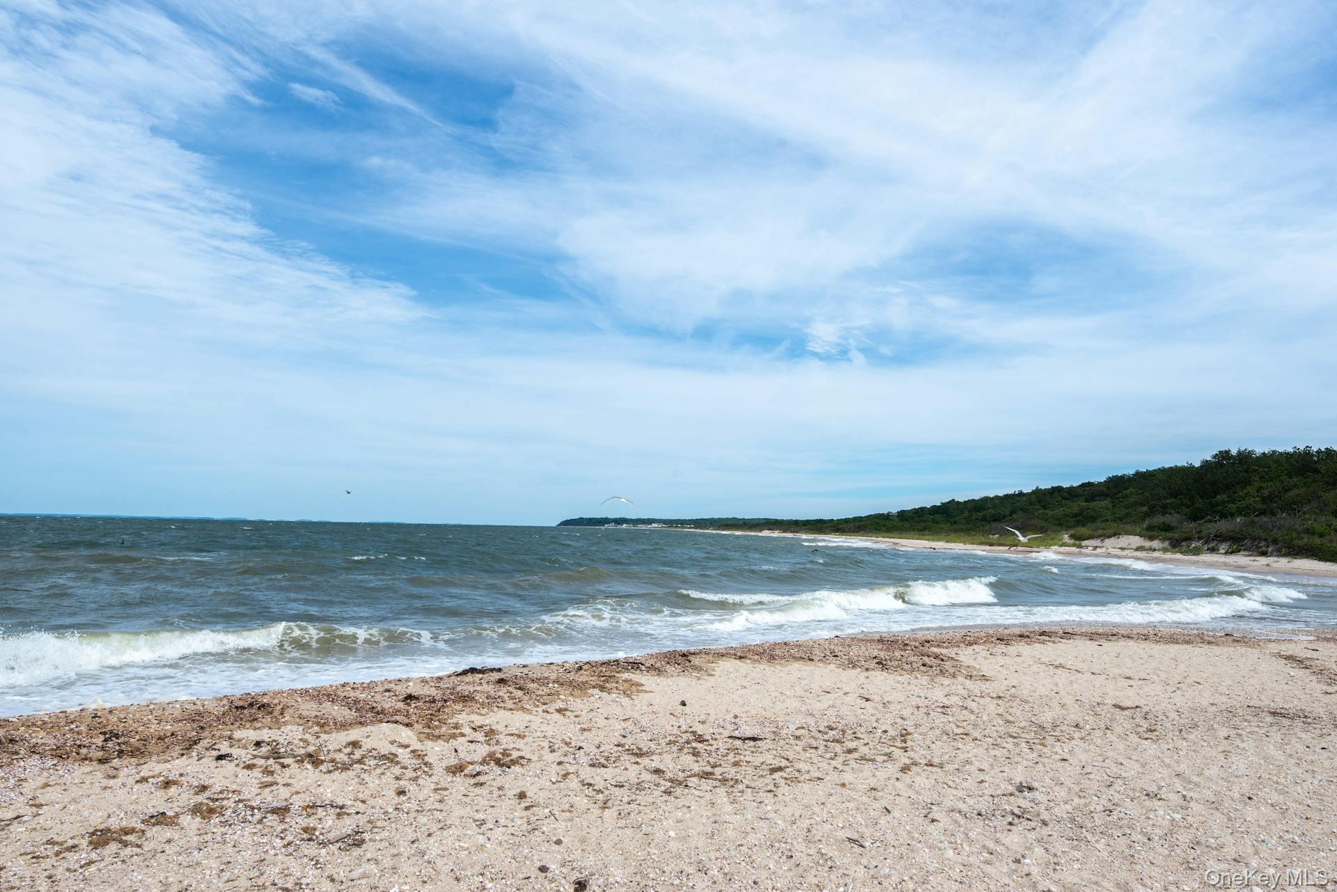 Build your dream home on this exceptional waterfront lot offering unobstructed, forever views and breathtaking sunsets over the pristine waters of the sound. With plans already in place, you can break ground on your custom home without delay. Nestled in one of the most sought-after locations on the North Fork, this property offers the perfect blend of privacy and convenienceâ€”just minutes from local vineyards, farm stands, dining, beaches, and marinas. Set in a serene and scenic location, this property offers direct access to miles of beach for peaceful walks along the shore, and is just moments from the tranquil Goldsmith Inlet, perfect for kayaking, paddleboarding, or simply enjoying nature at its finest. Whether youâ€™re looking for a peaceful weekend retreat or a full-time coastal haven, this rare opportunity delivers it all. Professional pictures coming soon.