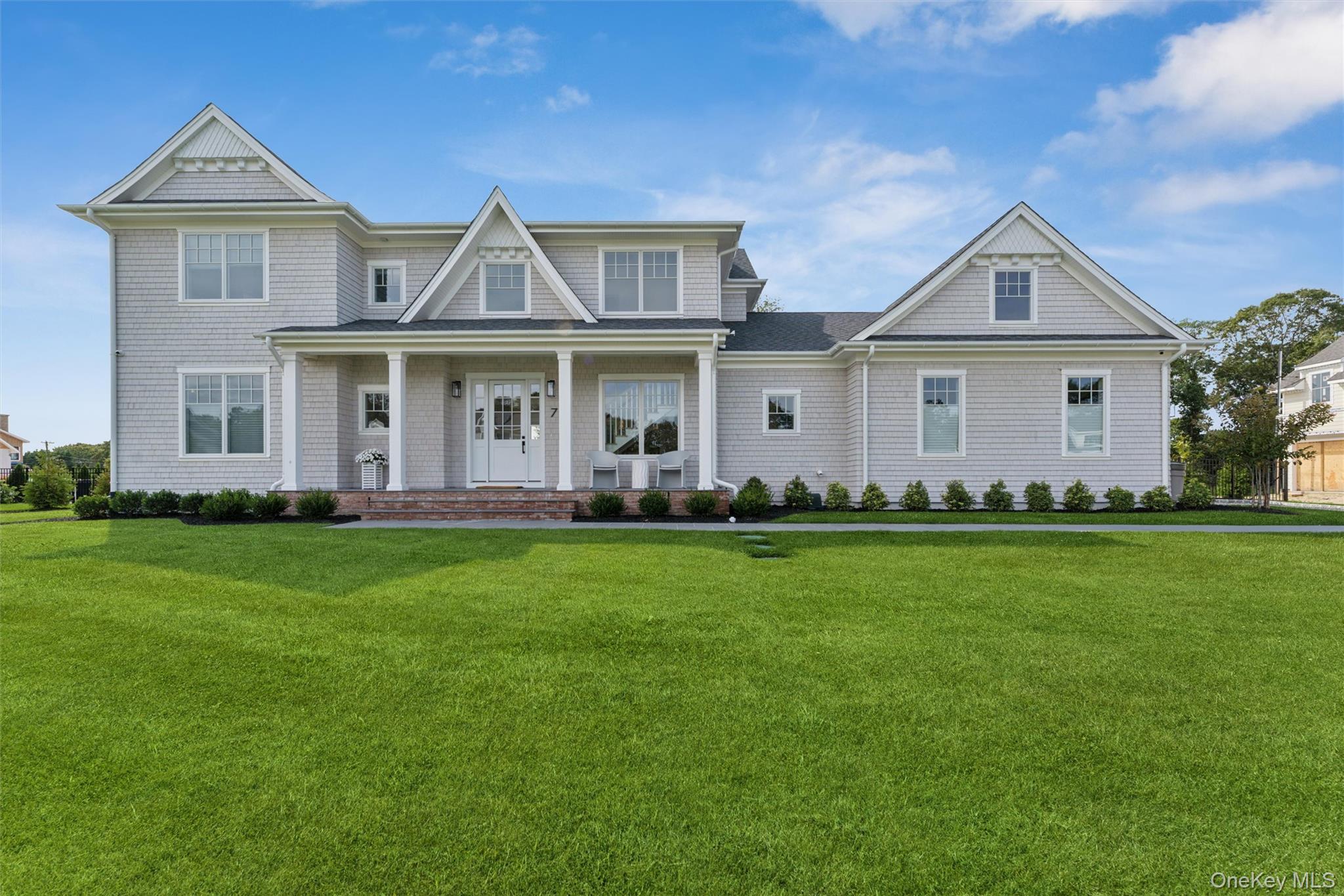 Welcome to 7 Margareta Court, a stunning new construction in the heart of Westhampton Beach. Designed with both luxury and comfort in mind, this 6 bedroom, 6.5 bath home offers an open floor plan with white oak hardwood floors, abundant natural light, and seamless indoor-outdoor living through sliding glass doors that open to a private backyard oasis. The gourmet eat-in kitchen is complete with a Wolf 6-burner range, Sub Zero refrigerator, Bosch dishwasher, center island with seating for 3, and spacious walk-in pantry, while the adjoining dining area seats eight. The first-floor master suite provides a serene escape with dual walk-in closets, a spa-like bath featuring an oversized walk-in shower with built-in bench, and elegant double vanity. Upstairs, four additional ensuite bedrooms-each with wall-mounted smart TVs-offer privacy and comfort for guests. A finished lower level expands the living space with a lounge area, oversized seating, and a sixth bedroom with bath access. Outdoors, enjoy the heated 35&rsquo; x 16&rsquo; pool with bluestone coping and stadium steps, ample lounge seating with umbrellas, and a spacious patio for dining al fresco. With additional luxuries such as high-speed WiFi, central HVAC, a security system, and access to Westhampton Beach village beaches, this home perfectly blends modern amenities with classic Hamptons charm. Ideally located just 1/2 a mile from the Westhampton train station, 1.5 miles to Main Street, and 2.5 miles to Rogers Beach, 7 Margareta Court is the ultimate Hamptons summer rental. Available August 2026.