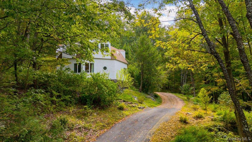 Inside a private wooded haven, this one-of-a-kind, pristine home will make you feel like you&rsquo;re on a never-ending vacation! Surrounded by 4.42 acres of old-growth trees, stone walls, hiking trails and unspoiled nature, this year-round or weekend residence feels like a fairy tale. Three bedrooms and two full baths are included in the 1666 square feet of sun drenched, airy spaces. Rescued in 2020 and completely and thoughtfully renovated with a modern aesthetic, 456 Oscawana Lake Road is ready for its next chapter.The first floor offers an expansive living room, formal dining room and a sparkling white kitchen with an amazing amount of counter space, breakfast bar, all brand-new stainless appliances as well as new quartz countertops. There is also a gorgeous, spa-like full bath that was renovated in 2024 on the main level. Upstairs, there are three private bedrooms with wonderful views of the surrounding beauty, the second full bath (also renovated) and a nicely sized laundry/utility room. Ample storage available in multiple large closets throughout the home in addition to an outdoor shed.While you&rsquo;ll feel a world away from it all, this location, just 90 minutes from Manhattan, is very convenient to the Peekskill and Garrison Landing train stations, Taconic State Parkway, world-class hiking trails, galleries, farmer&rsquo;s markets, dining & shopping with more options opening up every day. Lively weekend events are also just a short hop away in Beacon and Cold Spring. Move-in ready. Time to leave your cares behind and live a life that dreams are made of.