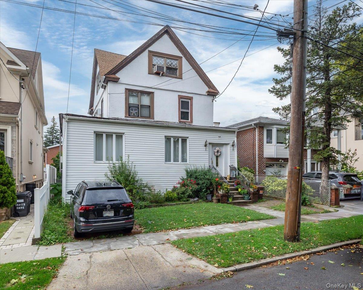 Beautiful 4-bedroom/2-bathroom in the Beechhurst section of Whitestone. Tons of value to unlock. Massive attic that can be converted into a 5th bedroom.