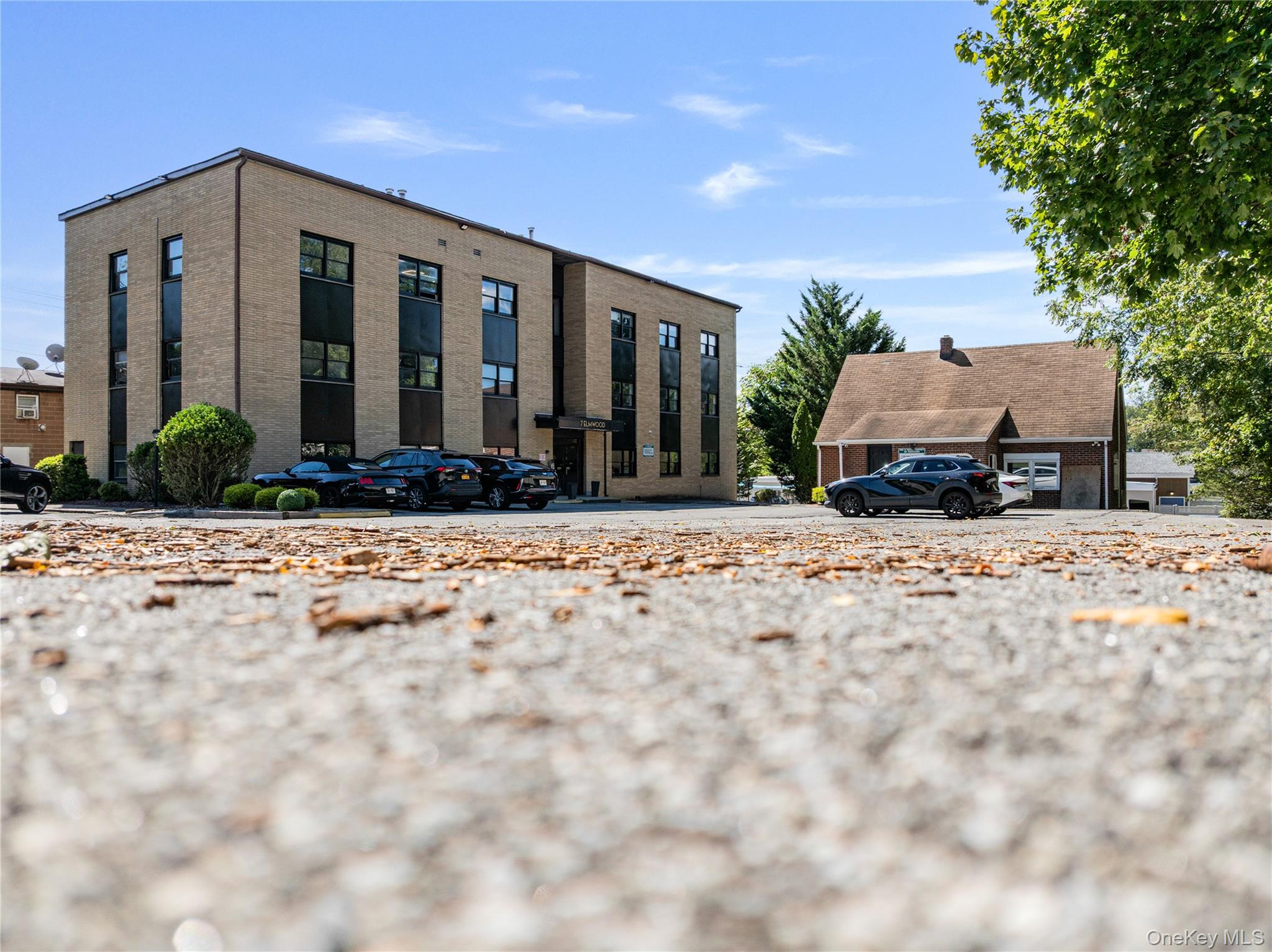 An excellent opportunity to lease professional office space in the heart of New City. This property has recently undergone an extensive renovation, offering modern finishes and a fresh professional environment. Conveniently located near the courthouse, shops, restaurants, and other local amenities, the building provides a central and accessible setting in Rockland County. The space is ideal for medical, legal, financial, or general office use, with flexible layouts designed to accommodate a variety of business needs. Large windows fill the offices with natural light, creating a bright and welcoming atmosphere, while ample on-site parking ensures convenience for staff and clients. With its prime location, upgraded interiors, and professional setting, 7 Elmwood Dr is an ideal choice for businesses looking to establish or expand their presence in Rockland County.
