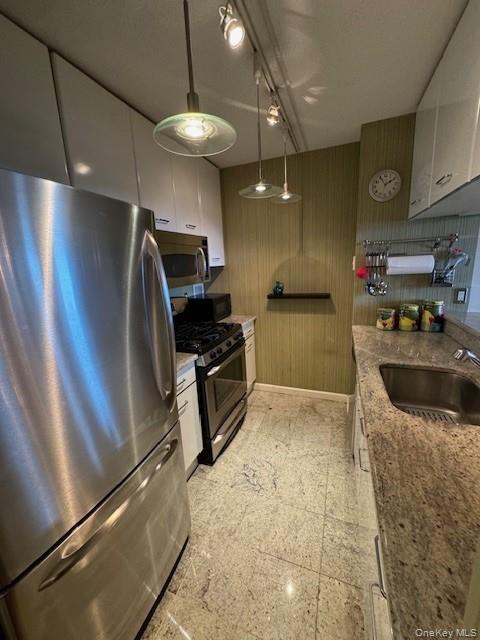 FULLY FURNISHED or UNFURNISHED! LONG or SHORT-TERM RENTAL. Here is your opportunity to live in this beautiful, spacious apartment on the 14th floor at The Seasons, a premier luxury condominium in the heart of White Plains just two blocks from the train station. This apartment home features breathtaking city views, 1-1/2 baths, stainless steel appliances, hardwood cherry floors, ample closets, granite/marble kitchen and baths, microwave, washer and dryer in the unit, queen bed (just bring your own mattress), mirrored dressing area, and well-appointed furniture and home decor throughout. Building amenities include a 24-hour concierge, fitness center, indoor heated pool, sauna/steam room, club room, and a backyard courtyard with gazebo and BBQ area. One unassigned indoor attached garage parking space is included! Easy walk to The Westchester mall, boutique avenue shopping, trendy restaurants, and walking/biking trails. You can also enjoy a 4.6-star restaurant on premises. You will love living here! This unit comes furnished or unfurnished, short term or long.