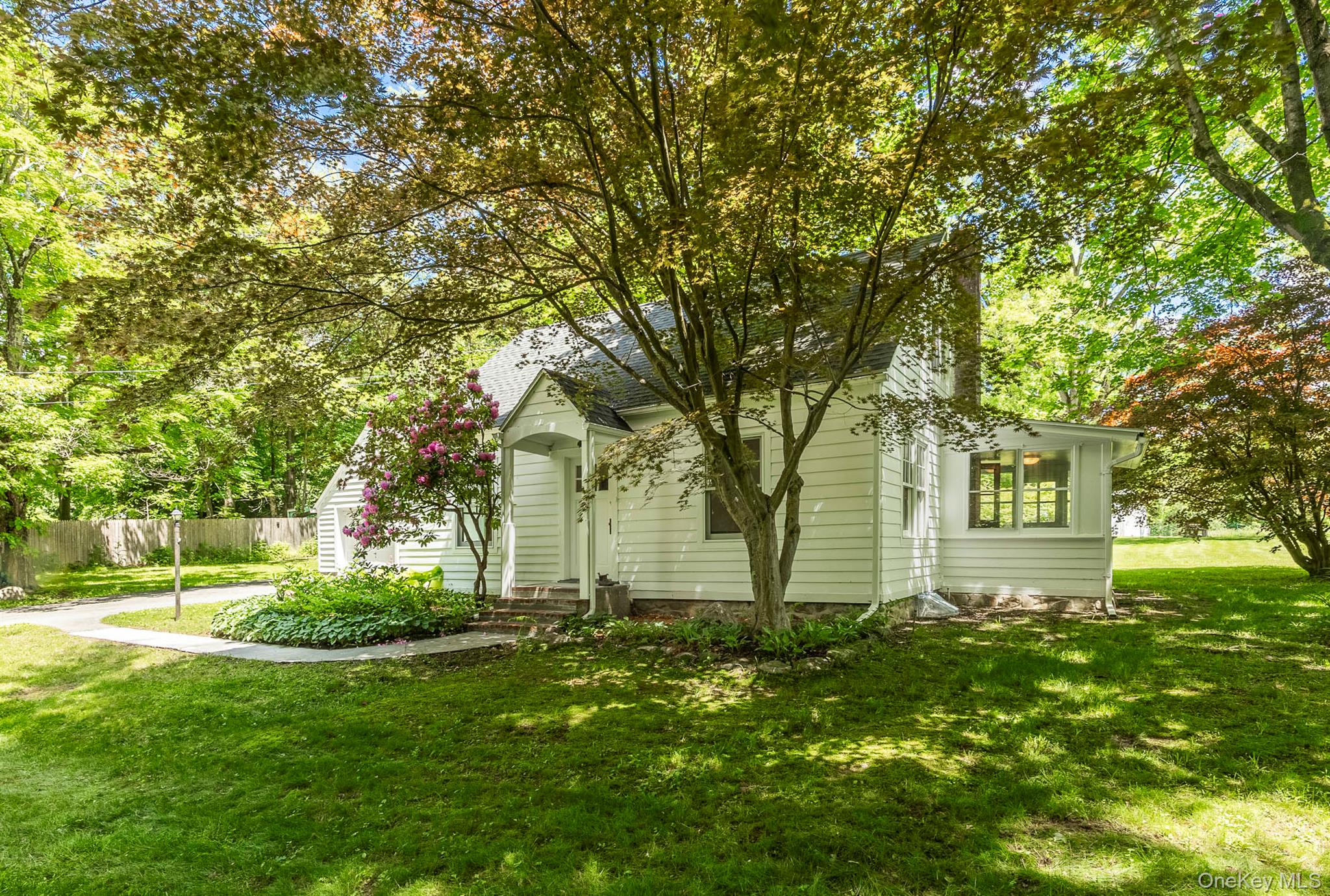 Fully Furnished cozy country Cape Cod house with garage in bucolic Dutchess County. Oak hardwood flooring throughout, the home features a spacious open living and dining plan. The moldings, brand new windows, doors, and railings provide a warm Mission/Arts and Crafts style interior. Plenty of storage is available in the eat-in kitchen. The full bathroom includes a tub. There is also a south facing, light filled sunroom and small work space on the first floor. Upstairs, you will find a beautiful landing and two separated bedrooms with vaulted ceilings. The property is set on about an acre with mature landscaping and backyard. Access is both on Rt. 82 and Millis Lane, leading to the charming hamlet of Bangall. Nearby newly renovated Stanford Recreation Park, farm markets, and Audubon nature trails. Close by to the villages with shopping and dining in Millbrook, Pine Plains, Millerton, Rhinebeck and more. Metro North Wassaic train station is also a short 18 minute drive. All of this is less than two hours from New York City. Welcome to the Hudson Valley.