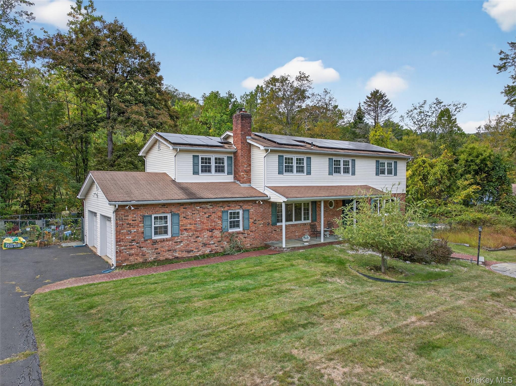 Nestled on just under an acre of lush, private grounds, this 5-bedroom, 3.5-bath Colonial is waiting for you. Tucked away in a serene and secluded setting, this home is a peaceful retreat just minutes from local amenities, schools, and commuter routes.Step inside to find a spacious and inviting layout ideal for both everyday living and entertaining. The main level features a sun-drenched living room, formal dining room, and a cozy family room with a woodstove, all flowing seamlessly into a your kitchen. Upstairs, youâ€™ll find a generously sized primary with a private en-suite bath, along with four additional bedrooms and 1 full bathroom, offering ample space for family, guests, or a home office setup.