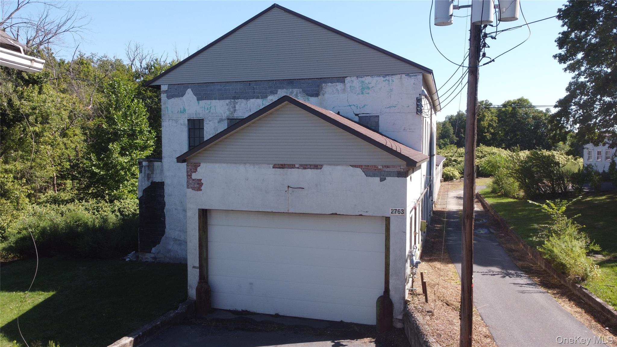 Amazing opportunity in the heart of Slate Hill!  Two parcels totaling .74 acres. Almost 12, 000 square feet of commercial space with two overhead doors, loading dock, and parking area.   Located in Minisink Valley Central School District and also Town Commercial 2 (TC2) zoning.  Please see agent remarks and MLS documents for additional information and allowable uses by right.