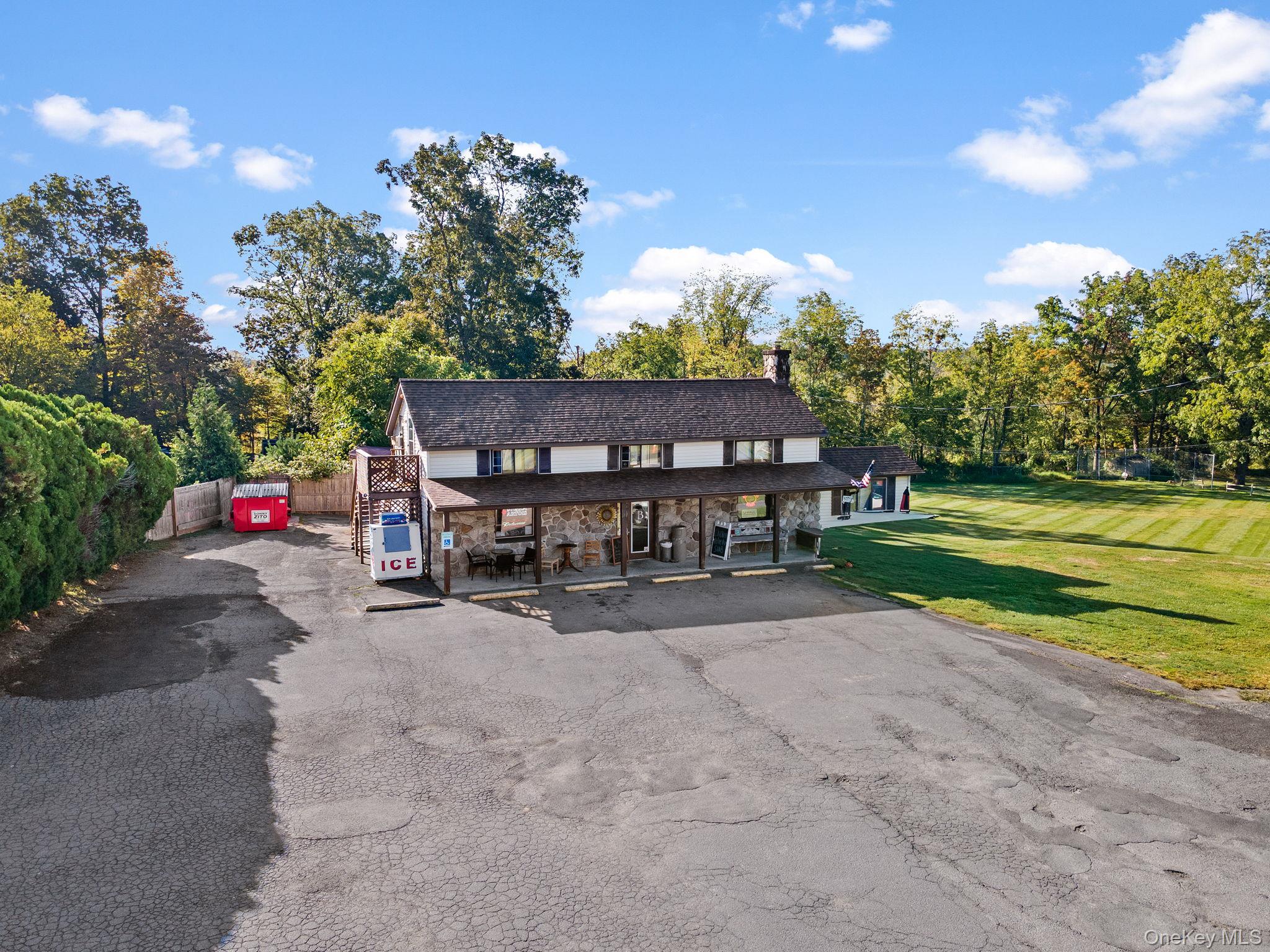 Hereâ€™s your chance to own a thriving deli and convenience store that locals know and love, along with the building and an income-producing apartment â€” all in one unbeatable package! Perfectly positioned on heavily traveled Burlingham Road, less than one mile to Route 52 and under 10 minutes to the Hamlet of Pine Bush, this property offers excellent exposure and nonstop traffic. The building makes a statement with its covered porch, and clear roadside signage, while the inside is set up for success. The deli features a spacious customer area with multiple dining tables for eat-in service, a full line of glass-door coolers, display cases, and food prep stations, and ample shelving for grocery and convenience items. Behind the scenes, the property is equipped with a fully functional kitchen, complete with stainless steel prep tables, a gas range with overhead hood, deep stainless sinks, double refrigerators, and extensive shelving and storage for dry goods and supplies. This area is designed to handle daily food prep with ease, making it ideal for deli operations or expansion into catering and events. A walk-in cooler, freezers, and additional storage provide even more support, and there is also a dedicated office space for management, as well as a bathroom conveniently located off the storage area. Additionally featuring a whole building generator powered by propane, great for those unexpected power outages. Generator feeds the deli and upstairs apartment without any stress. Above the business, the one-bedroom apartment offers its own private exterior entrance and deck, along with hardwood floors and a kitchen/dining area combo, providing comfortable living quarters and steady rental income with room to increase. The property spans 1.8 acres, including a large paved lot with parking for 25+ vehicles, an open field, picnic/entertaining area perfect for events, and a separate one-car garage for storage. With its warm, welcoming atmosphere, proven community reputation, and multiple income streams, this is a turn-key investment package with endless potential for an owner-operator or investor ready to grow, expand, or simply enjoy the returns.