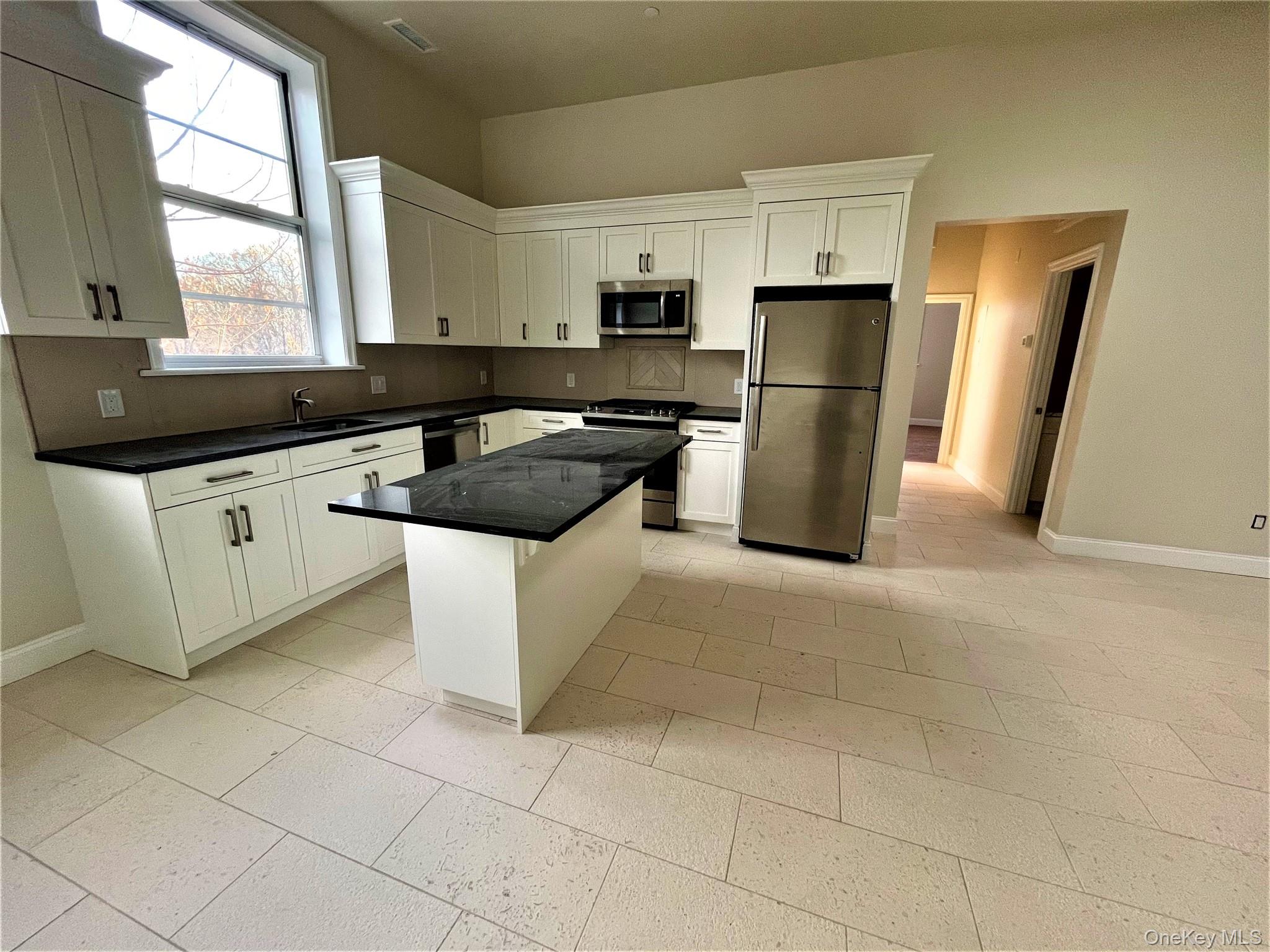 You will fall in love with this FULLY RENOVATED Immaculate 2BR/2BA Apartment located on Main Street in downtown Ossining! This fully accessible ground-level unit is teeming with elegance and historic charm, offering many great amenities, including Central Air, BIG Closets, Hi-End Finishes, and an exposed brick wall. Just 48 minutes by Train to GCS (and just a few short blocks away), and Close to restaurants, recreation, and shopping! The apartment is on the first floor and has lovely light quality (including a few skylights!). Enjoy Hardwood Floors in bedrooms, Imported Stone Tile Floors in living/kitchen, and entry hall, Marble Countertops in Kitchen and Bathroom Vanity, plus Custom Wood Cabinets with Under Cabinet and lighting! All of the appliances are new and High Efficiency, including a Gas Range, Dishwasher, Washer & Dryer (inside the unit), Large refrigerator, and over-range microwave with Hood Built-in. The apartment also has a Large Pantry Closet with built-in Shelves, and the Closets in the Bedroom have built-in storage as well! Stow away suitcases and seasonal clothes in the Overhead Storage units in Bedrooms. Safety features include a Doorbell Buzzer System and Secured hallways with code locks at two locations. The unit also has high-speed Internet access, Wired for Optimum, and Verizon. You&rsquo;ll enjoy a bustling downtown area with proximity to the Metro North Train Station, as well as Markets, Restaurants, Cafes, a Pharmacy, a Bookstore, and a Post Office. Parking is Municipal by the Village of Ossining (you will need to get a tag for your car - not expensive!), with Multiple lots within 1 block. Ossining is an Artsy and Upcoming Community located along the majestic Hudson River with beautiful views! The unit can be accessed with zero steps and is wheelchair accessible. Tenant is responsible for utilities. Apply via RentSpree!