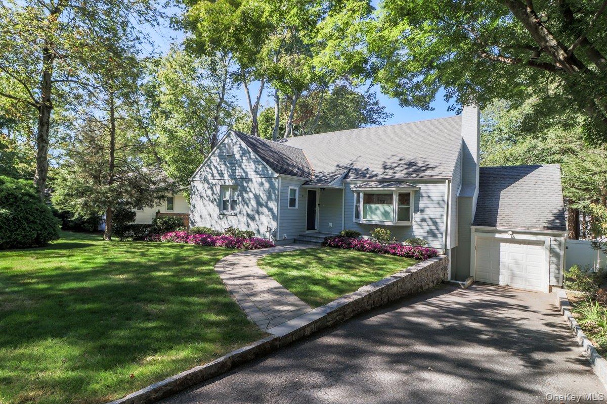 This attractive and impressive, freshly painted home sits on a quiet tree-lined street. Fall in love with this stylishly renovated and ready for occupancy home. This spacious 5-bedroom gem offers unparallel comfort and privacy for everyone. The floor plan allows for open concept living, central air conditioning and hardwood floors throughout the home. The main level features a renovated kitchen with stainless steel appliances, dining room, living room with brick fireplace, family room with sliders to trex deck, 3 bedrooms and 2 bathrooms. Second level has 2 bedrooms and 2 bathrooms. The fully finished, newly updated basement offers a versatile space for recreation, guests or home office. Step outside to a private, fully fenced backyard with easy access for play, relaxation, or gatherings. Commuting to NYC is a breeze, with only a 25-minute journey via Metro North or the highway.