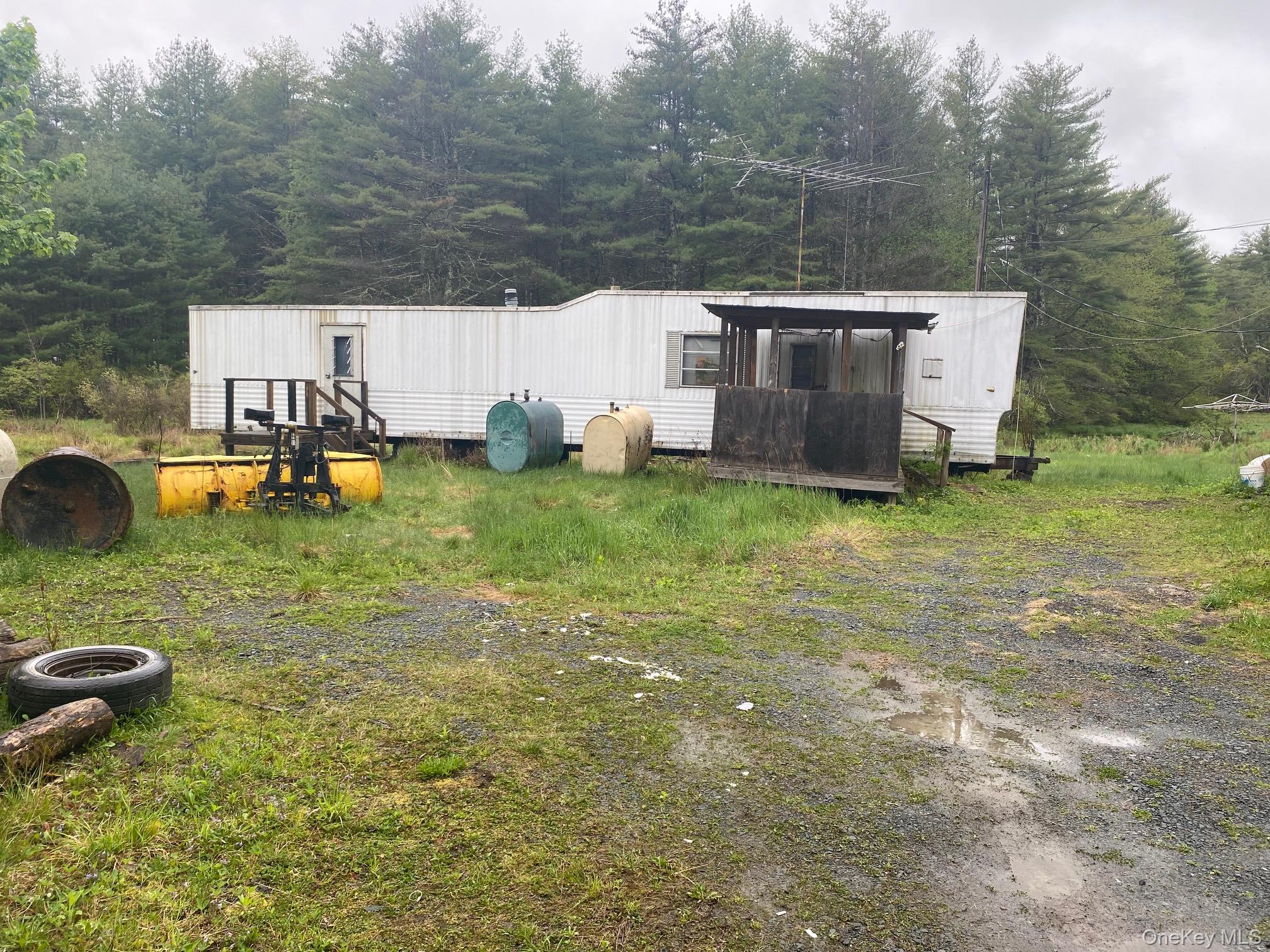 25x25 ft garage, and smaller old mobile home on property can be replaced. has electric and well and septic small stream in rear , level lot consisting of 2 parcels lot size total is 1.5 acres. Additional Information: ParkingFeatures:1 Car Detached,