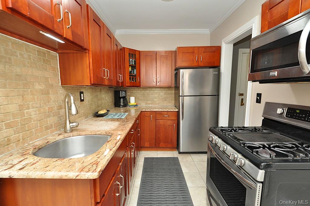 Welcome to this Pet Friendly beautifully renovated one-bedroom home, perfectly located just one block from the Fleetwood Metro-North station, shops, restaurants, and entertainment. Ideal for commuters, this home offers both convenience and comfort in a vibrant neighborhood setting. Upon entry, youâ€™re welcomed by a spacious foyer that leads into a bright living room and a modern eat-in kitchen. The kitchen has been tastefully updated with granite counter tops, stainless steel appliances, cherry wood cabinetry, and a window for natural light and ventilation â€” perfect for cooking and casual dining. The generously sized corner bedroom features hardwood floors, two windows that provide great light, and a walk-in closet for ample storage. The living room is ideal for relaxing or entertaining guests, with a layout that feels open yet cozy. Additional highlights include hardwood floors throughout, a large cedar lined coat closet and a linen closet. Building amenities include on-site laundry, bike and storage room/closet, and a resident gym at additional monthly fee(s). Donâ€™t miss the opportunity to live in one of Fleetwoodâ€™s most desirable locations â€” a perfect blend of style, space, and convenience! PET FRIENDLY building -allows up to 2 dogs and 3 cats pending board approval.
