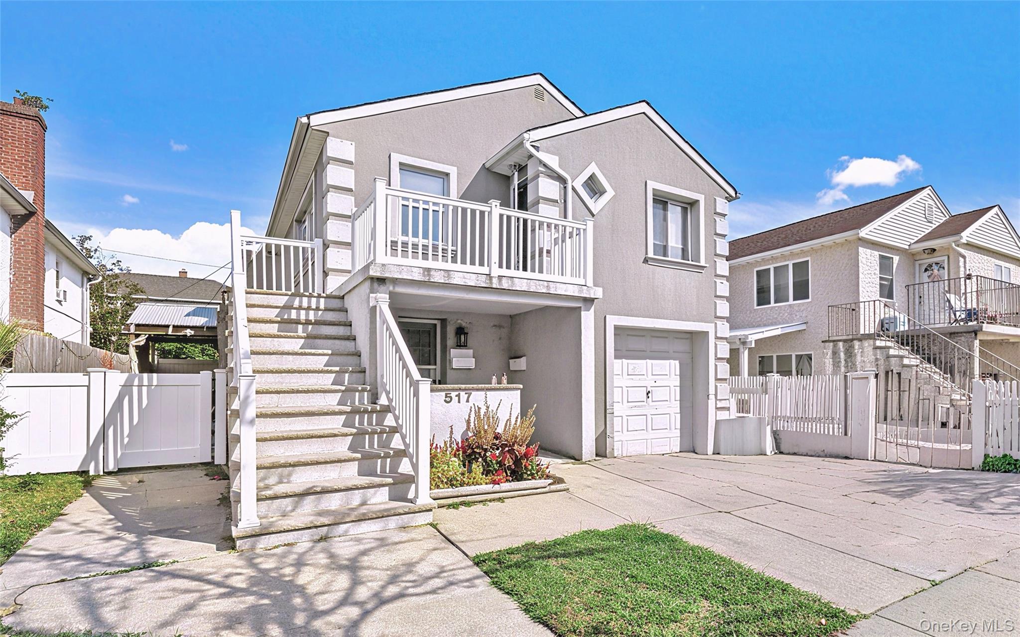 Enjoy coastal living in this second-floor apartment just one block from the beach. This bright and spacious rental features three bedrooms and one and a half bathrooms, including a convenient half-bath ensuite in one of the bedrooms. The apartment offers hardwood floors throughout, central AC, attic and garage storage, and a private backyard. Additional amenities include driveway parking and a shared washer and dryer located in the garage. Landlord covers heat, water, hot water, gas, and laundry utilities, with the tenant responsible only for electricity. Move-in ready and ideally situated near the water, this rental combines comfort, convenience, and a prime Long Beach location.