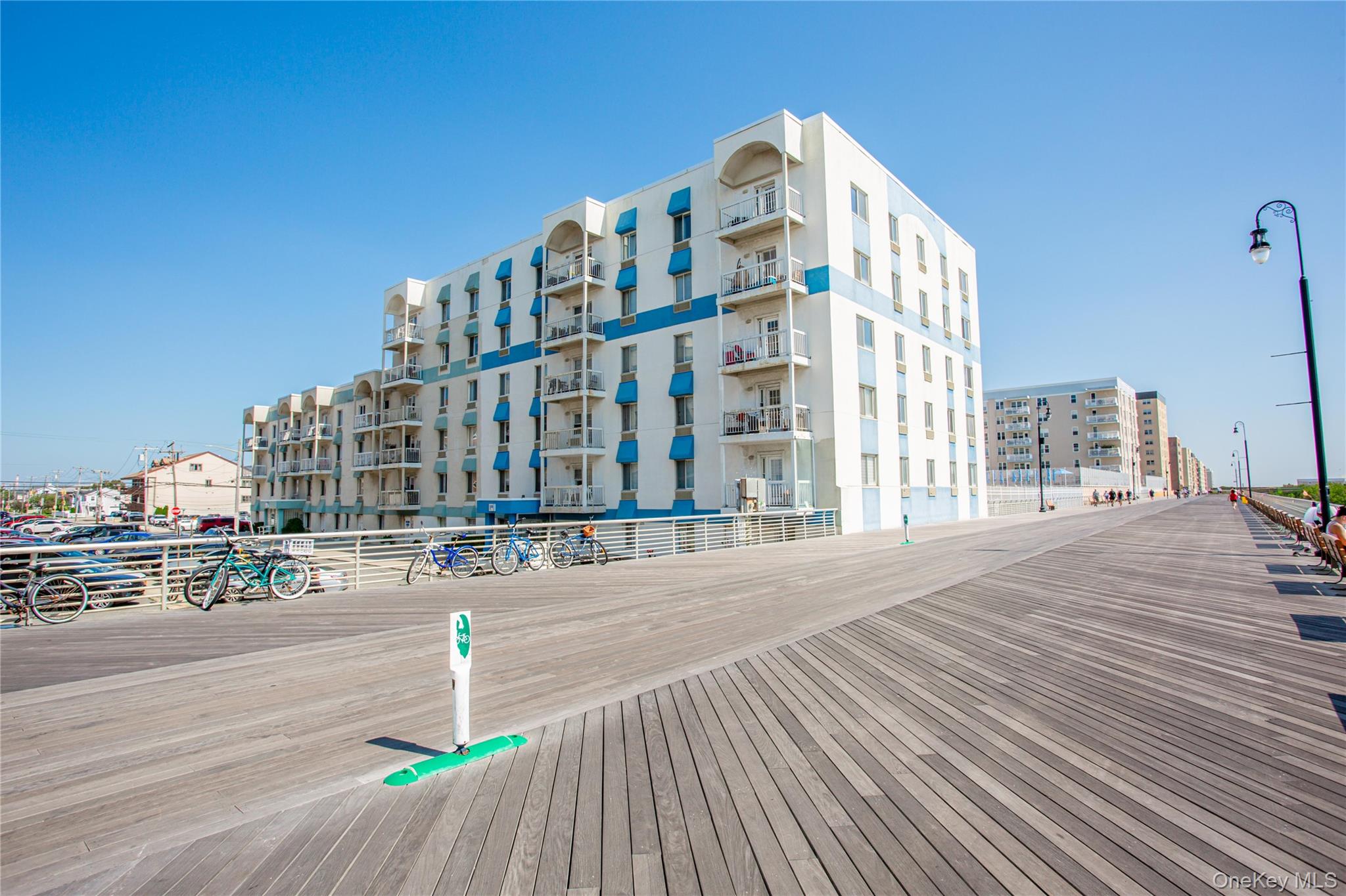 This large 1-bedroom apartment in an oceanfront building offers stunning ocean views, overlooking the boardwalk and the beach. The unit features a brand-new kitchen with all new appliances, an electric oven/range, Quartz countertops, and stylish tile finishes in both the kitchen and bathroom. Hardwood floors add warmth throughout. Residents enjoy the convenience of shared on-site laundry facilities and a parking lot available on a first-come, first-served basis. Building has access to the pool.