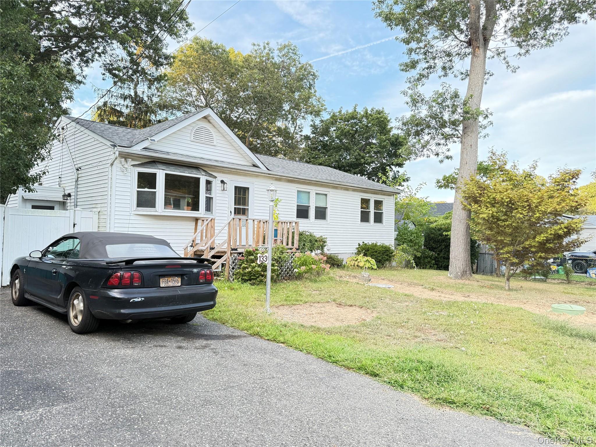 Beautiful and spacious ranch for rent in Mastic! This home offers 5 bedrooms and 3 full bathrooms, an inviting eat-in kitchen with stove and refrigerator, and elegant hardwood flooring throughout the main living areas. A fully finished basement provides excellent space for recreation, storage, or a home office. Enjoy year-round comfort with oil-based heating, plus a fenced yard and plenty of room to relax outdoors. Conveniently located near shopping, parks, and major roadways, an ideal choice for households needing space and comfort!