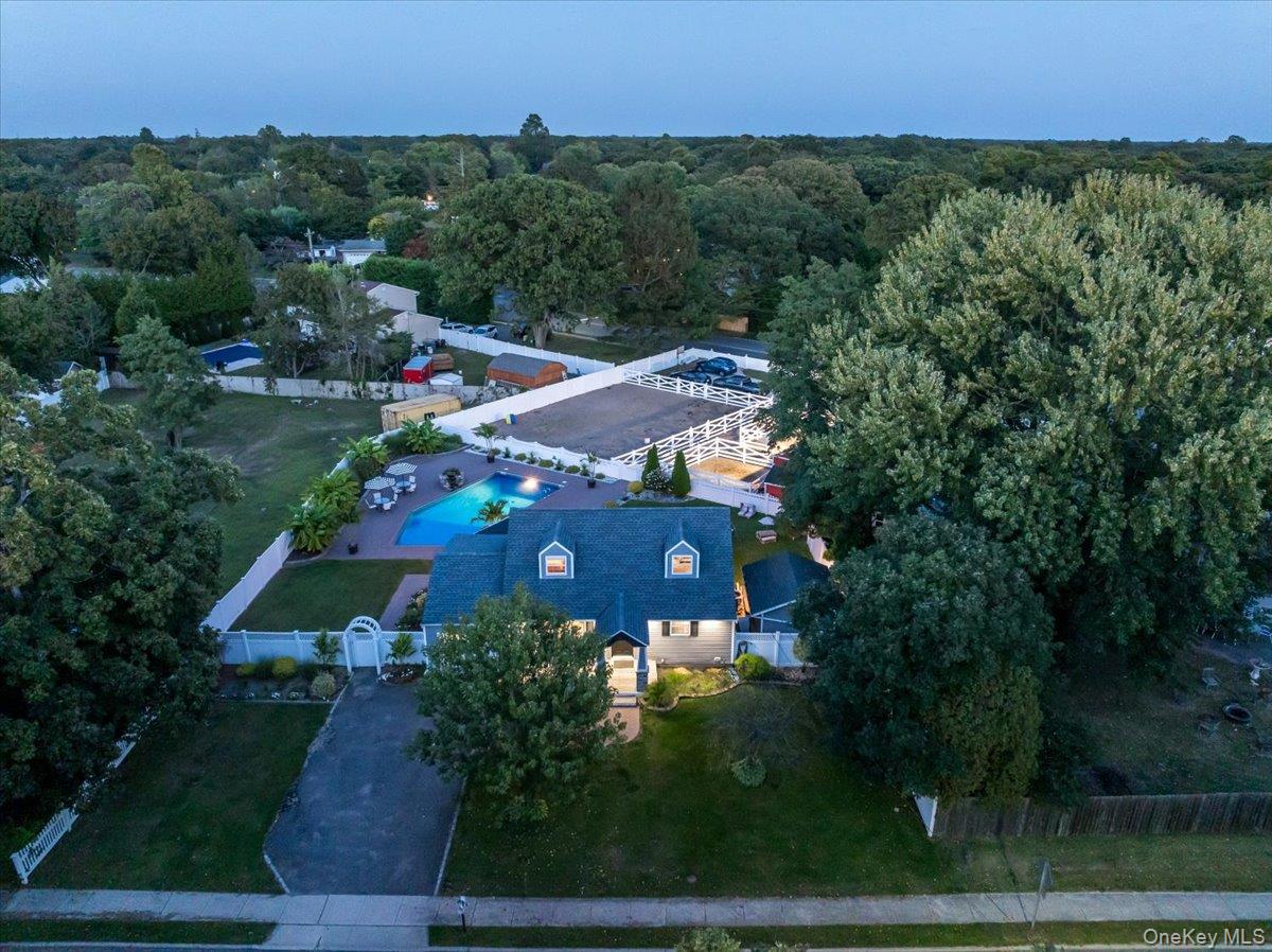 A Horse Lover&rsquo;s Paradise with Endless CharmWelcome to your dream home in the heart of Bohemia! This stunning 4-bedroom Cape is more than just a house; it&rsquo;s a lifestyle. Situated on a serene, picturesque horse property.Step inside to a completely updated kitchen, a chef&rsquo;s delight featuring top-of-the-line appliances, sleek countertops, and custom cabinetry. The open layout is perfect for entertaining, with a seamless flow into the sun-drenched living areas. The home&rsquo;s four bedrooms provide ample space for family and guests.But the real magic lies outside. Imagine spending your summers lounging by the sparkling in-ground pool, or hosting unforgettable barbecues in your incredible outdoor kitchen. This al fresco cooking space makes entertaining a breeze! For those with a passion for horses, this property is a true gem. A classic barn stands ready for your equestrian needs, and direct access to bridal paths means you can saddle up and explore the beautiful local trails.A one-car garage provides convenient storage and protection for your vehicle. This unique property is a rare find, combining exceptional outdoor amenities with a beautifully renovated interior.