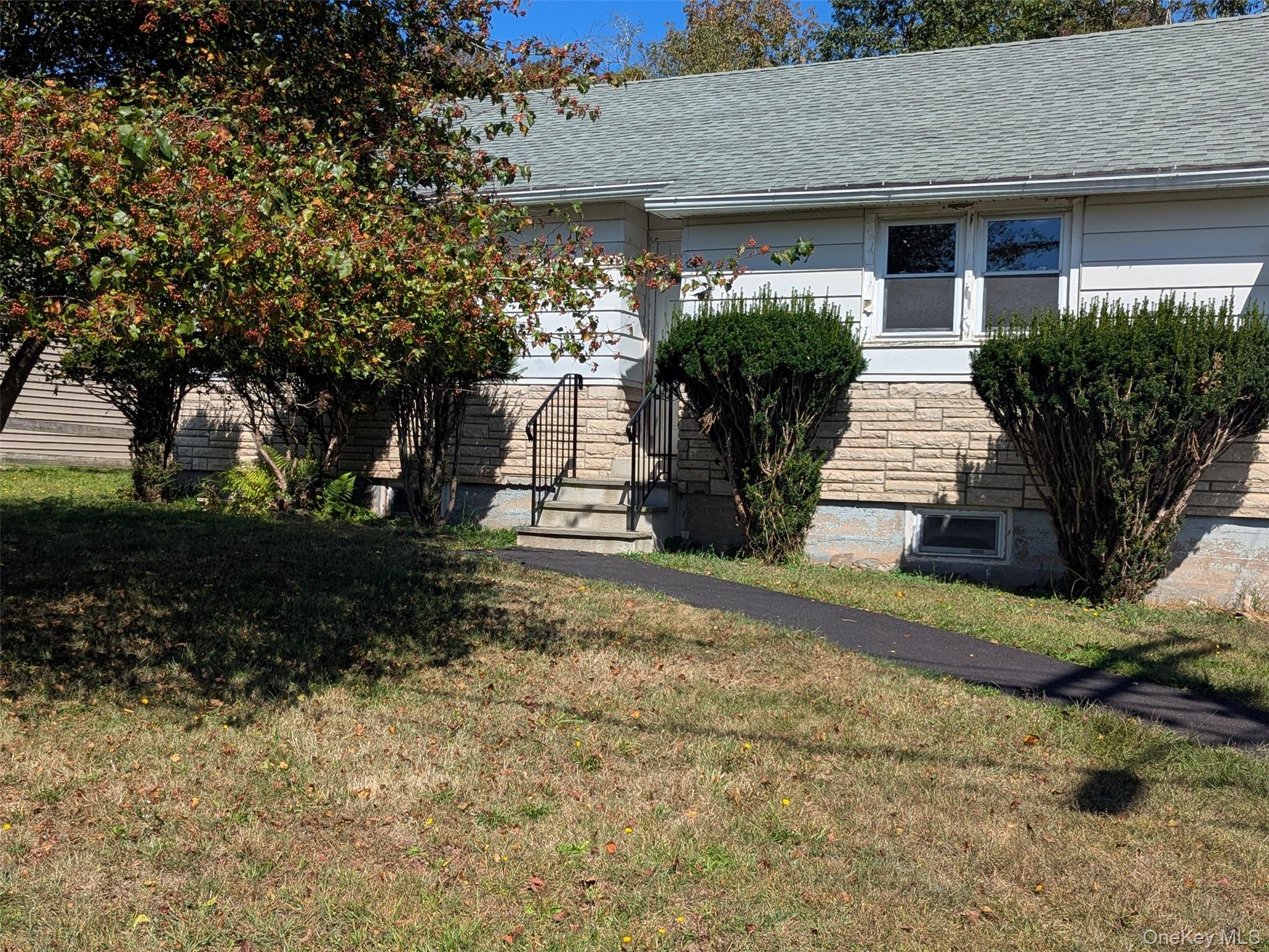 This recently renovated ranch-style residence is situated on a quiet street in the Town of Woodbourne. The home features two bedrooms positioned at opposite ends of the house for privacy, one bathroom, an eat-in kitchen, and a spacious living room. It is offered partially furnished and includes a nicely sized, fenced yard. A full basement provides ample additional storage space. Conveniently located near shopping and dining options in town, this property is also a short drive from Liberty and Monticello, as well as attractions such as the Kartrite Water Park and Bethel Woods Performing Arts Center.