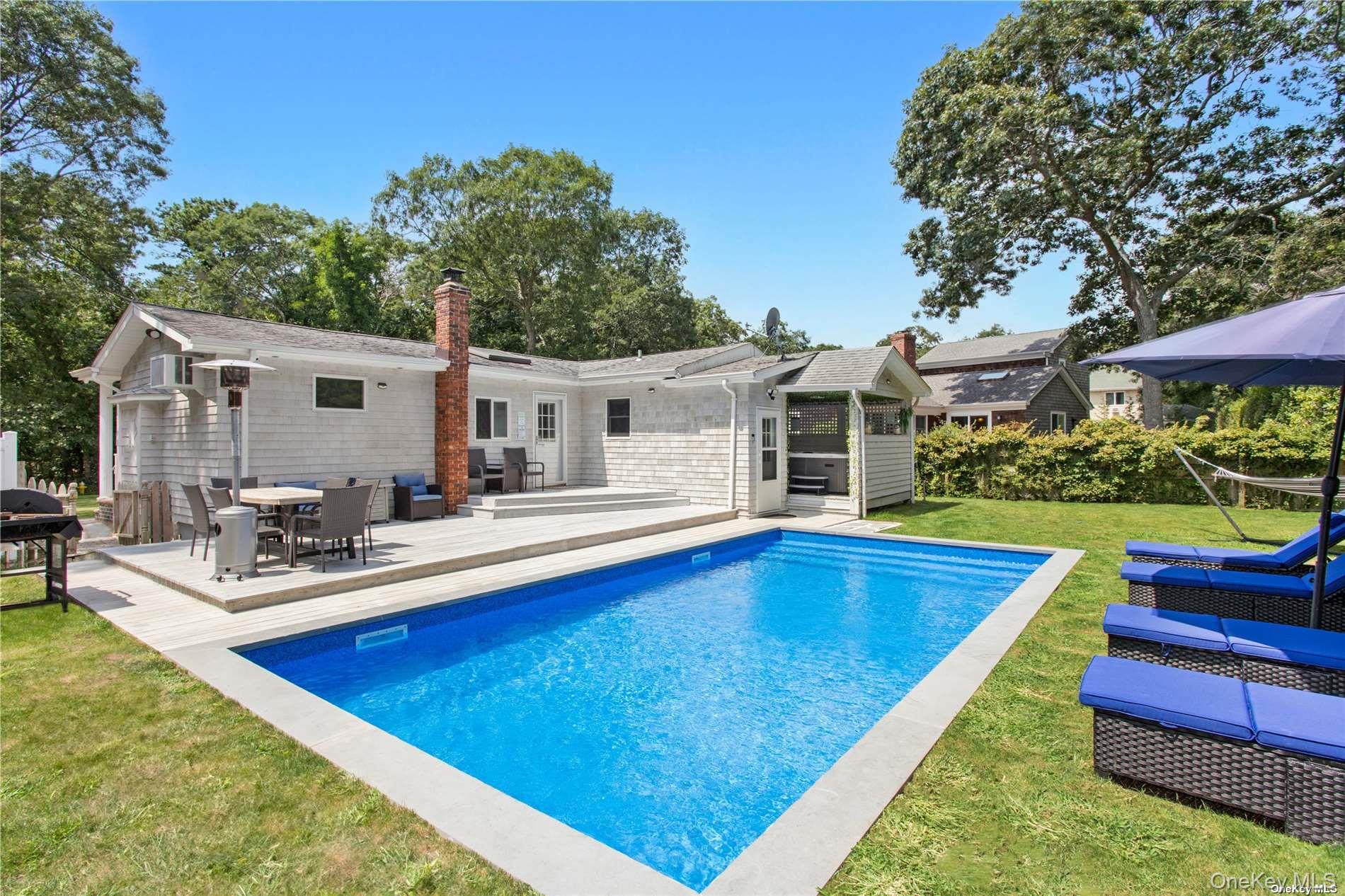Unveiling a hidden gem in East Quogue now available as a year-round rental. This newly renovated haven is tucked away in a quiet, private neighborhood and offers a seamless blend of modern comfort and relaxed Hamptons living. Meticulously updated with stylish finishes, this residence features an inviting open layout and thoughtful amenities throughout. Step outside to your own private oasis, complete with a brand-new heated gunite pool and hot tub, designed for extended seasonal enjoyment. The fully fenced backyard ensures ultimate privacy, making it perfect for both entertaining and peaceful retreat. Whether you&rsquo;re relocating or looking for a year-round sanctuary, this home delivers elevated living in a serene East End setting. Not furnished, asking $5, 000/month for year round.