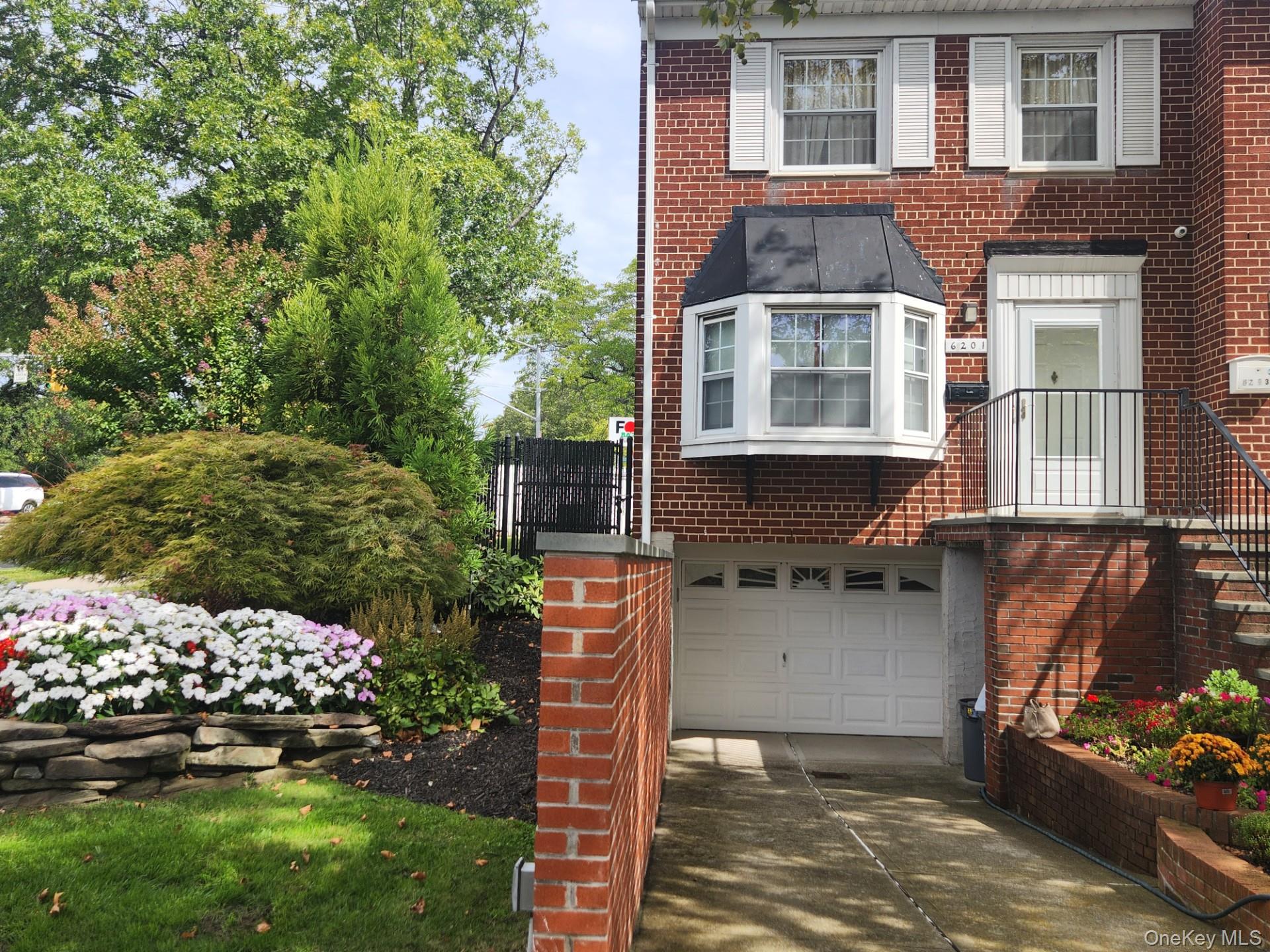 semi-detached triplex condominium with the private backyard.