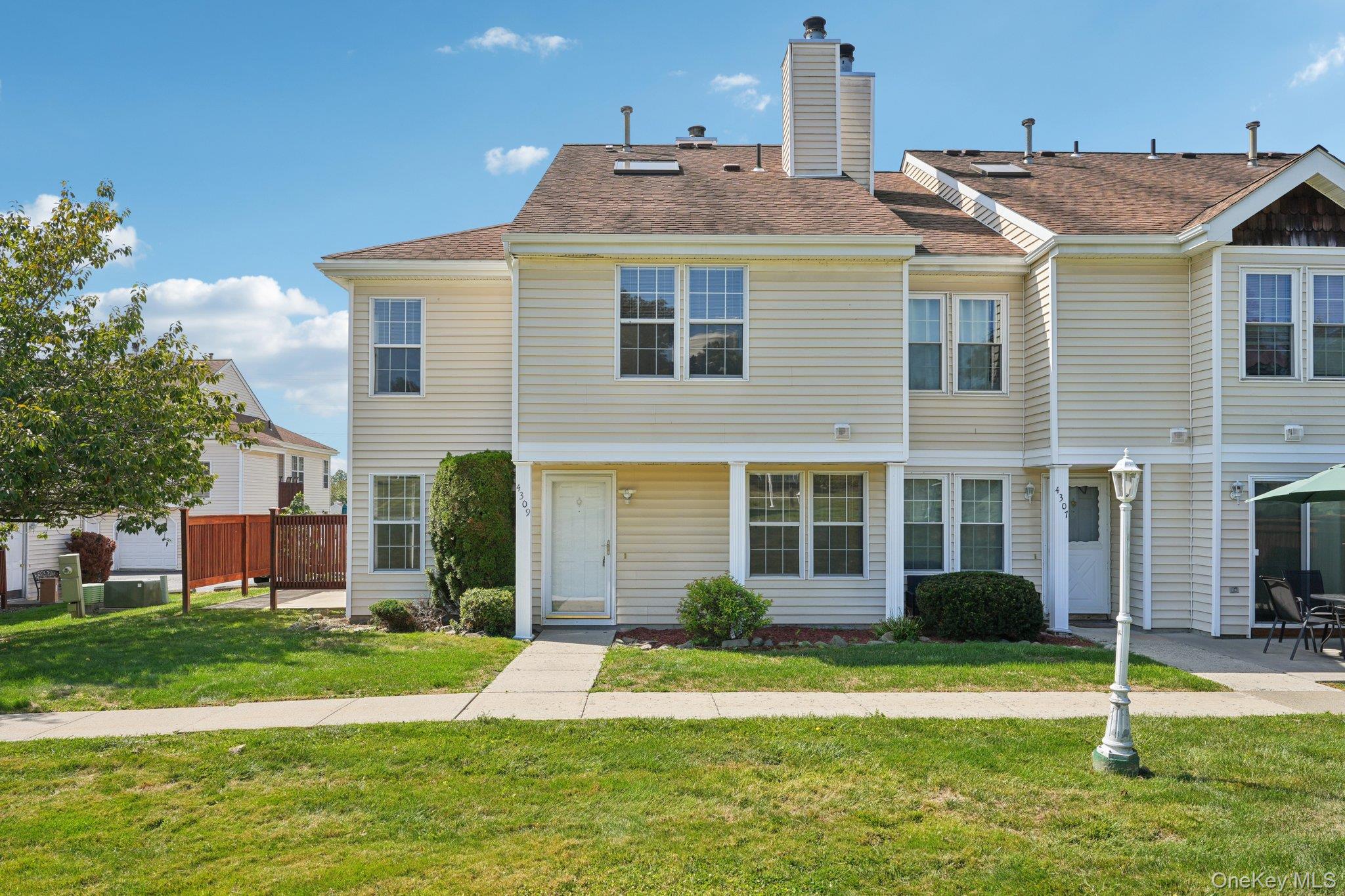 Welcome to this beautifully updated end-unit condominium in the highly sought-after Whispering Hills community of Chester, NY. This 3-bedroom, 2.5-bath home greets you with gleaming new white marble floors on the main level, a bright and inviting living room with a cozy fireplace, and a well-appointed kitchen featuring new stainless steel appliances and bright with Natural light. Step outside to your own private patioâ€”perfect for morning coffee, dining al fresco, or entertaining guests. The second floor has all hardwood floors. The spacious primary suite offers large windows, an on-suite bath, and generous closet space. Two additional bedrooms and a full bath provide comfort and flexibility for family, guests, or a home office. Other features include New Central AC, a New Boiler, New Hot Water Heater and Updated bathrooms. Move in ready wit no worry of any repairs or updates as even the roof is newer and recently replaced by the HOA. This condo has an over sized 2 car garage. Whispering Hills also has a community pool, club house and basket ball and tennis/pickle ball courts and playgrounds. There is a bus stop to the city on Whispering Hills Drive. Substantial High quality Updates all included.