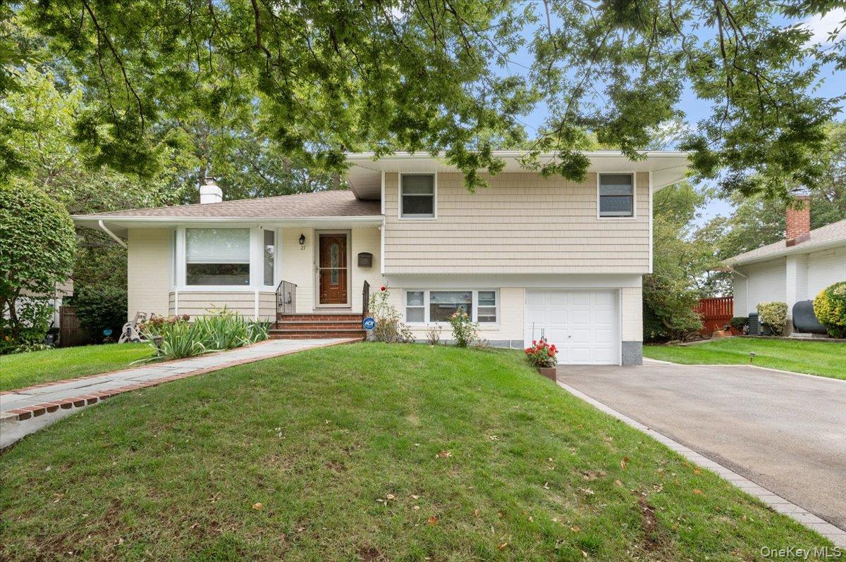 Donâ€™t miss this exceptional opportunity to own a fully renovated 4-bedroom home tucked away on a quiet block in the highly sought-after Jericho School District. Featuring beautiful hardwood floors throughout, this home offers a formal dining room and kitchen with serene park-like views. Four generously sized bedrooms include a primary en-suite, complemented by two additional full baths. The partial finished basement with high ceilings and stylish tile flooring provides versatile space for a playroom, home gym, or office. Additional highlights include a brand-new gas boiler, ductless AC system, and more. Perfectly located within walking distance to shopping, dining, Jackson Elementary, and the Jericho Library, this turn-key home is a rare blend of style, comfort, and convenience in a tranquil setting.