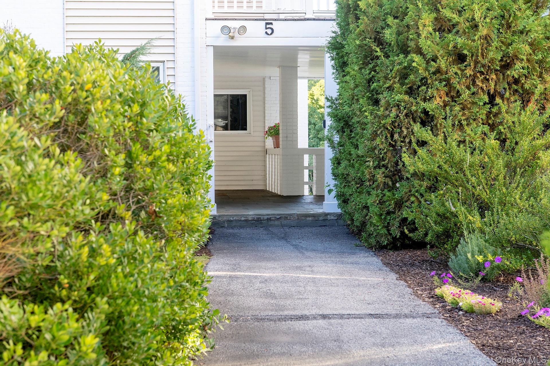 Welcome to Bennett Commons, the new â€œInâ€ place to live! Now surrounded by the beautiful 35 acre Bennett Park. Enjoy an abundance of nature with breathtaking views right in your backyard. This 2 bedroom, 2 bath condo features hardwood floors, an eat-in-kitchen and formal dining room. The living room offers an elegant wood burning fireplace with sliding glass doors leading to a spacious deck overlooking the magnificent grounds.  With southern and western exposure, this unit offers plenty of natural light. The primary bedroom comes complete with an en-suite bathroom and laundry area. A detached 1 car garage offers ample room for storage.  Bennett Commons is a small but vibrant community on 10+ acres with a lovely pond. A new pool and pool house are currently being built. Phase 3 of Bennett Park will include more walking trails alongside a stream and waterfall including a path to the charming village of Millbrook with great restaurants and quaint shops.  Donâ€™t miss this great opportunity to enjoy all this exclusive community has to offer.